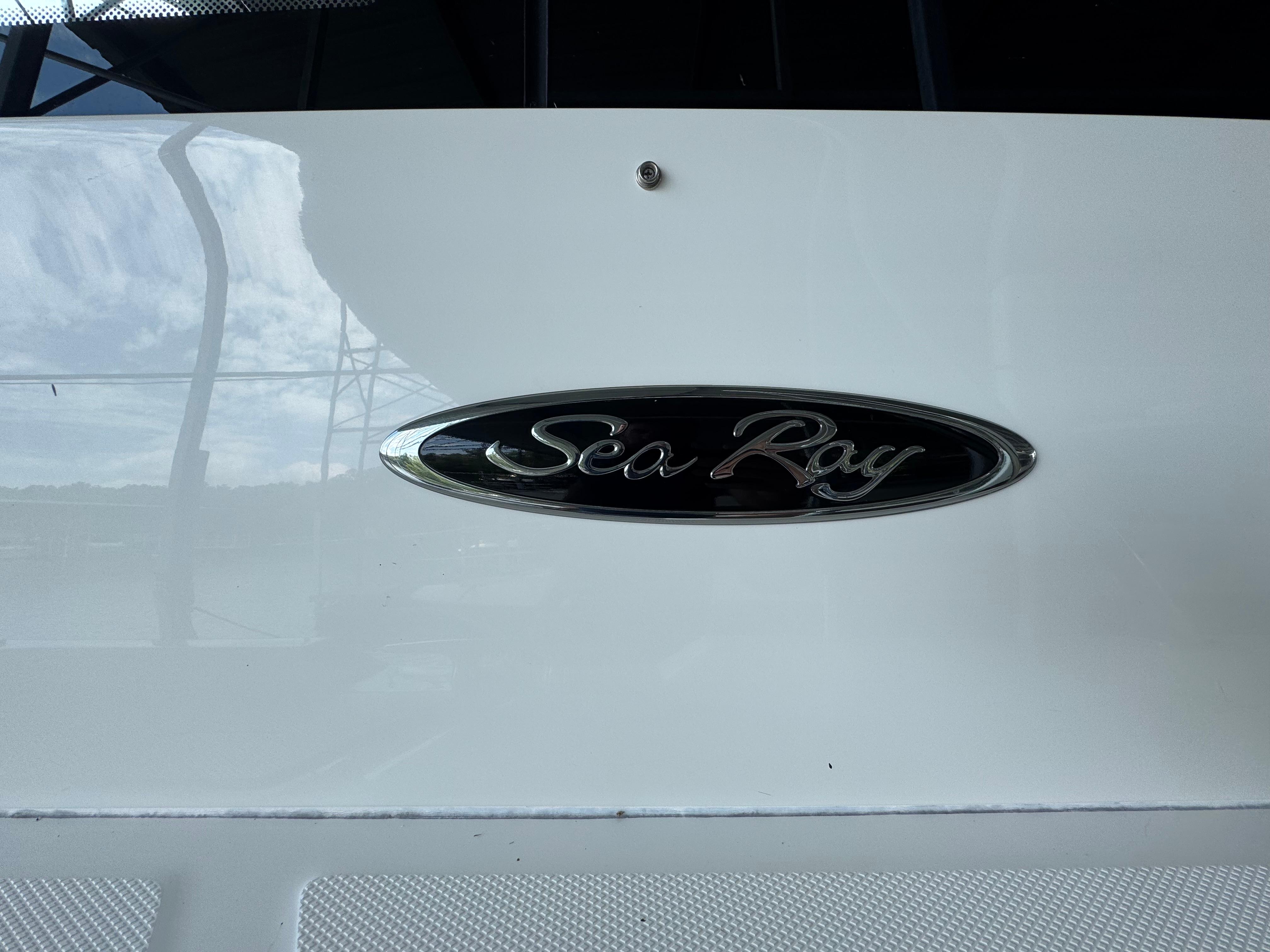 Sea Ray Sundancer 400 emblem on a 2017 model yacht, close-up view.