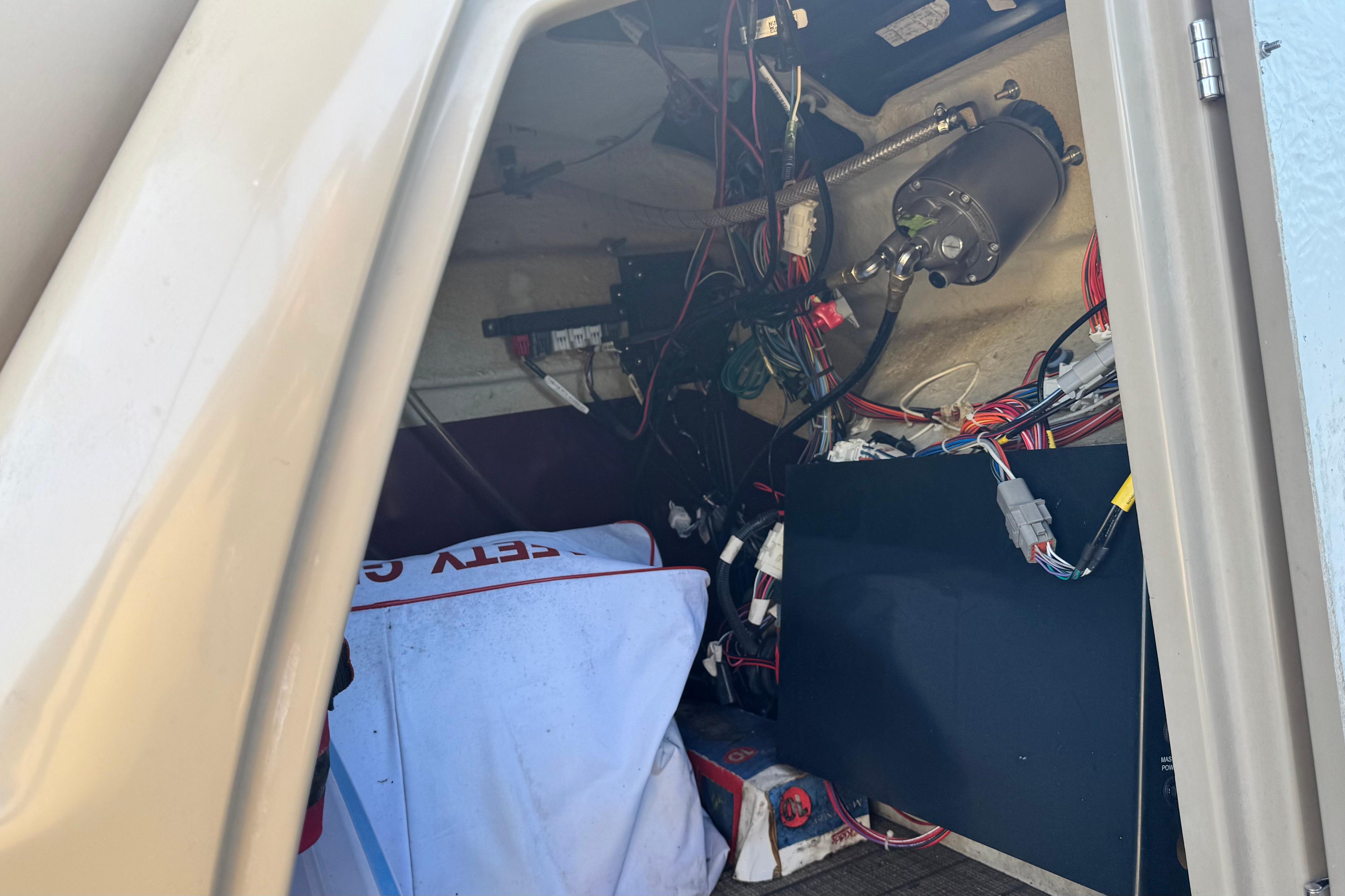 Interior view of 2023 Sylvan L5 CLZ boat showing wiring and components.
