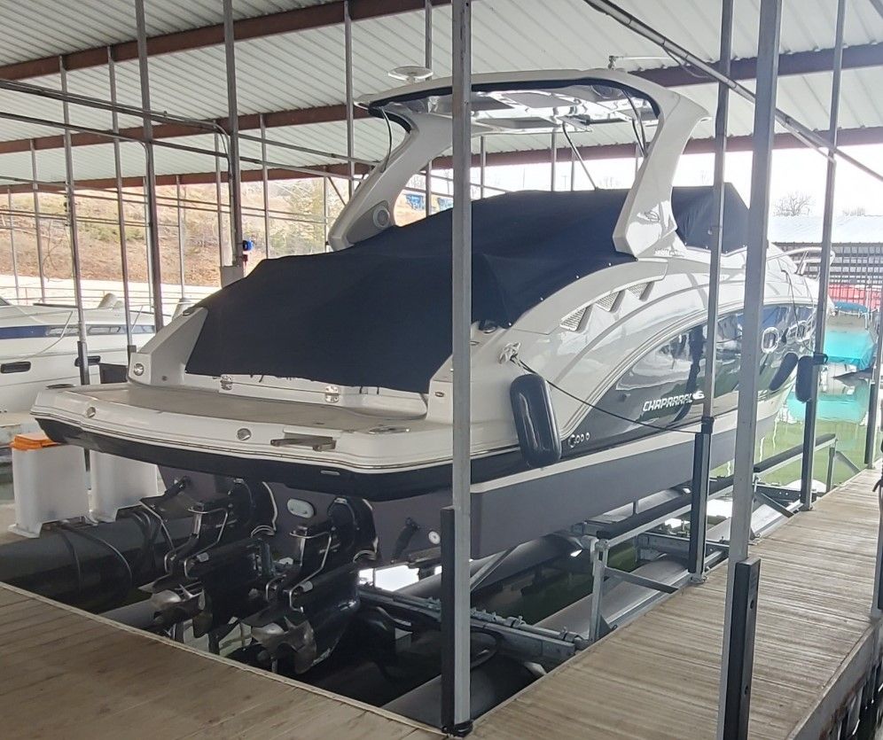 2014 Chaparral 330 Signature yacht docked, side view.