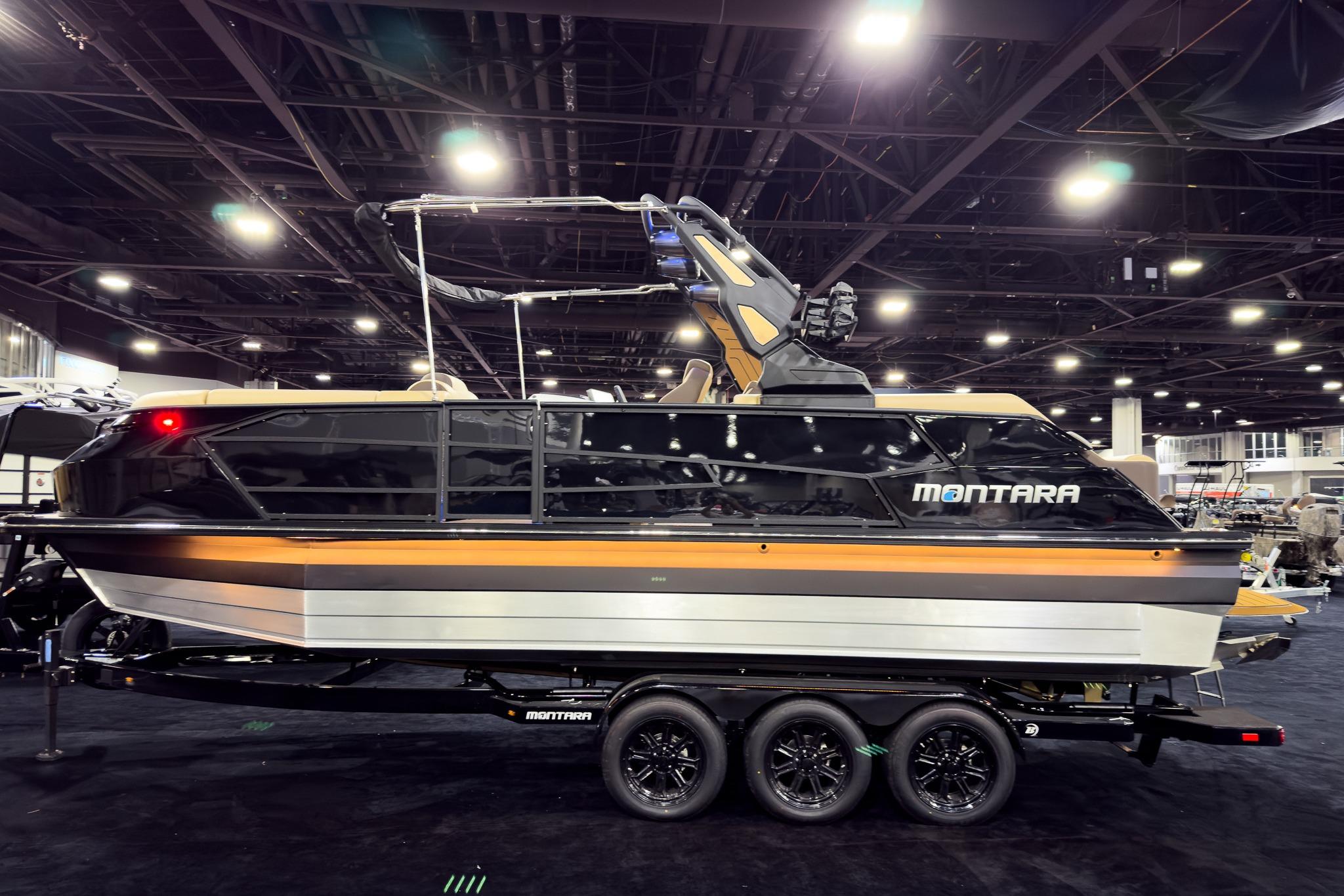 2026 Montara Surf Boss EVO SLDH 25' boat displayed indoors on a trailer.