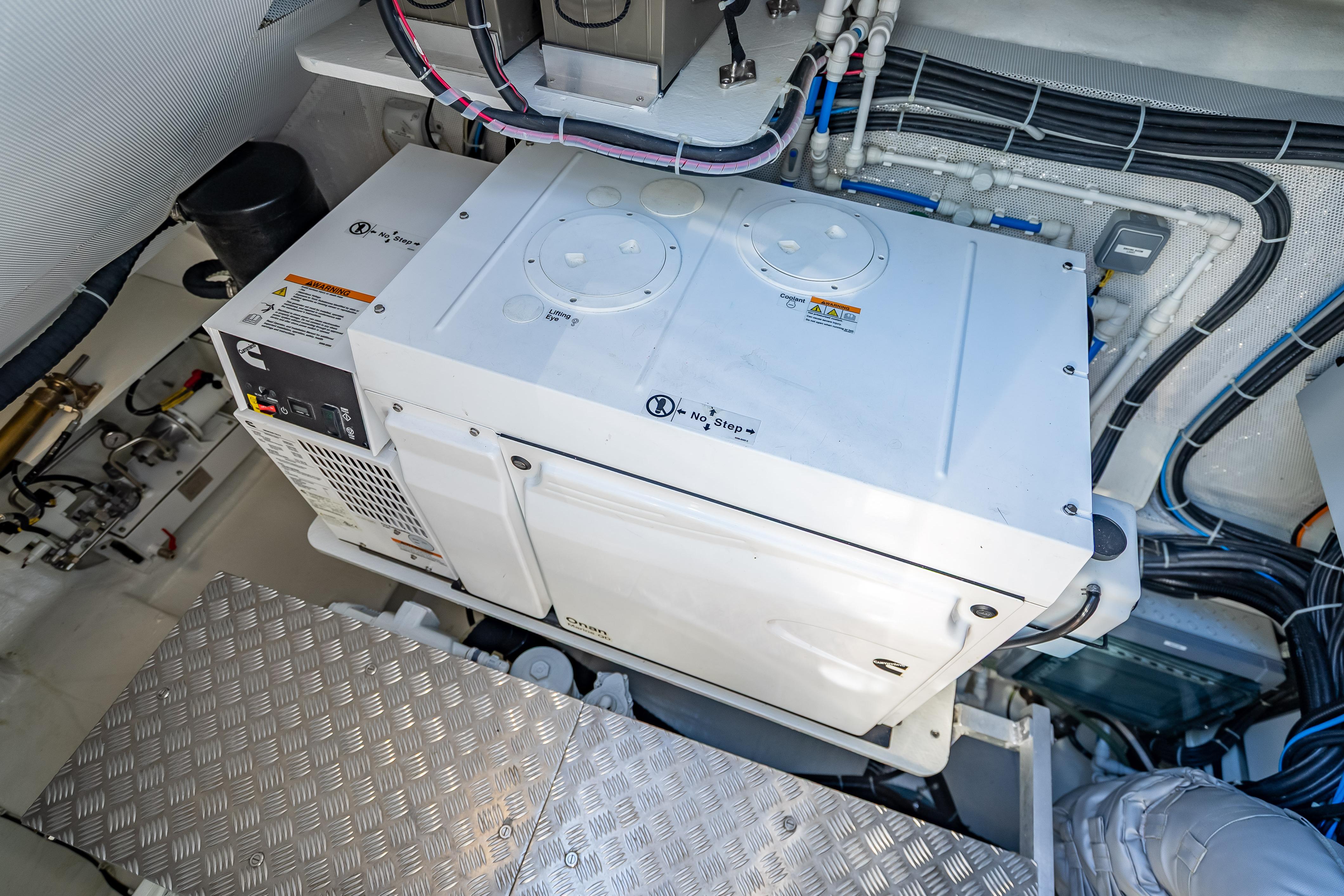 Engine room of 2026 Sunreef 60 Power yacht with generator and wiring.