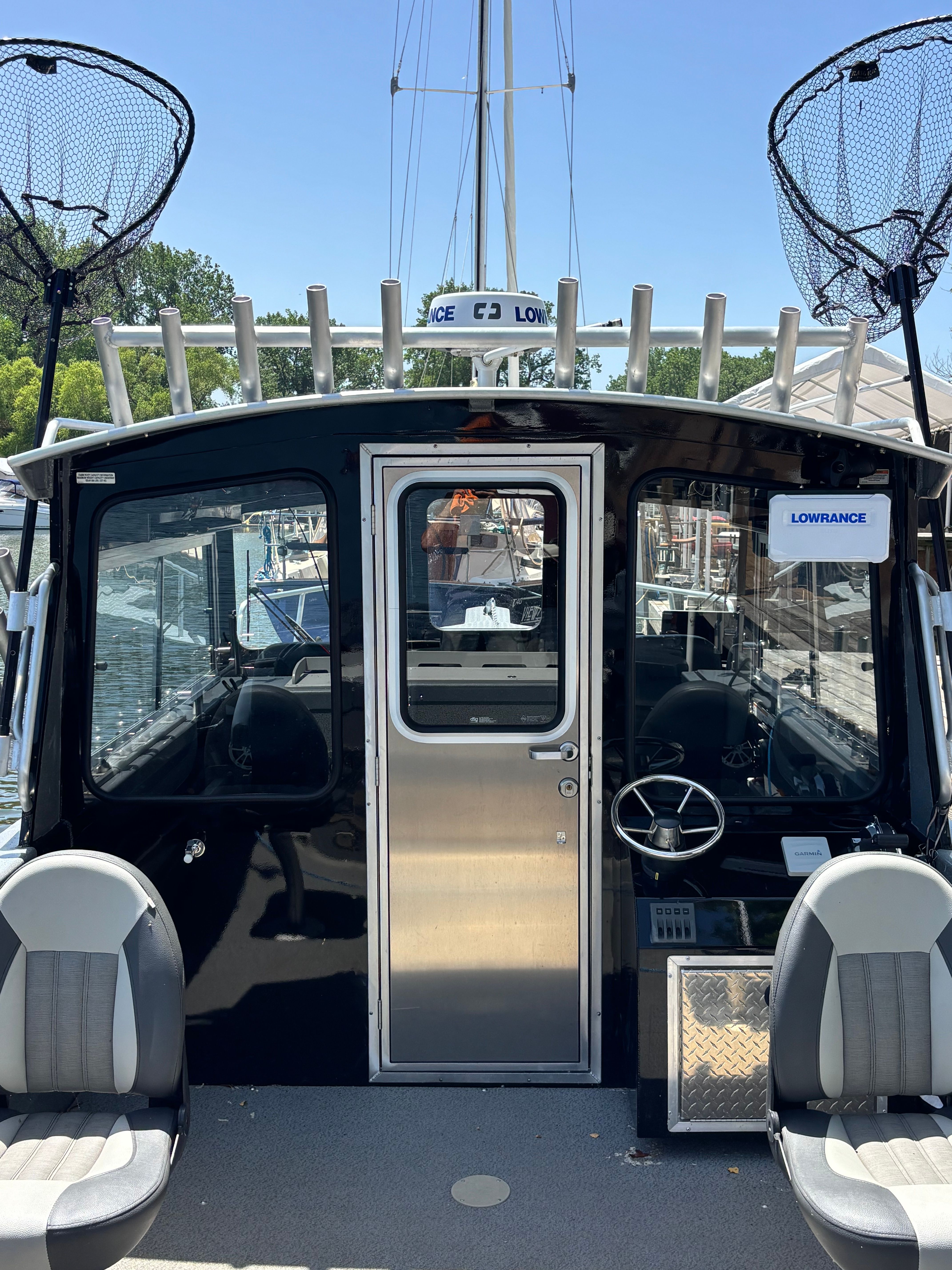 The image shows the cockpit of a 2021 Spartan 240 Maximus boat.