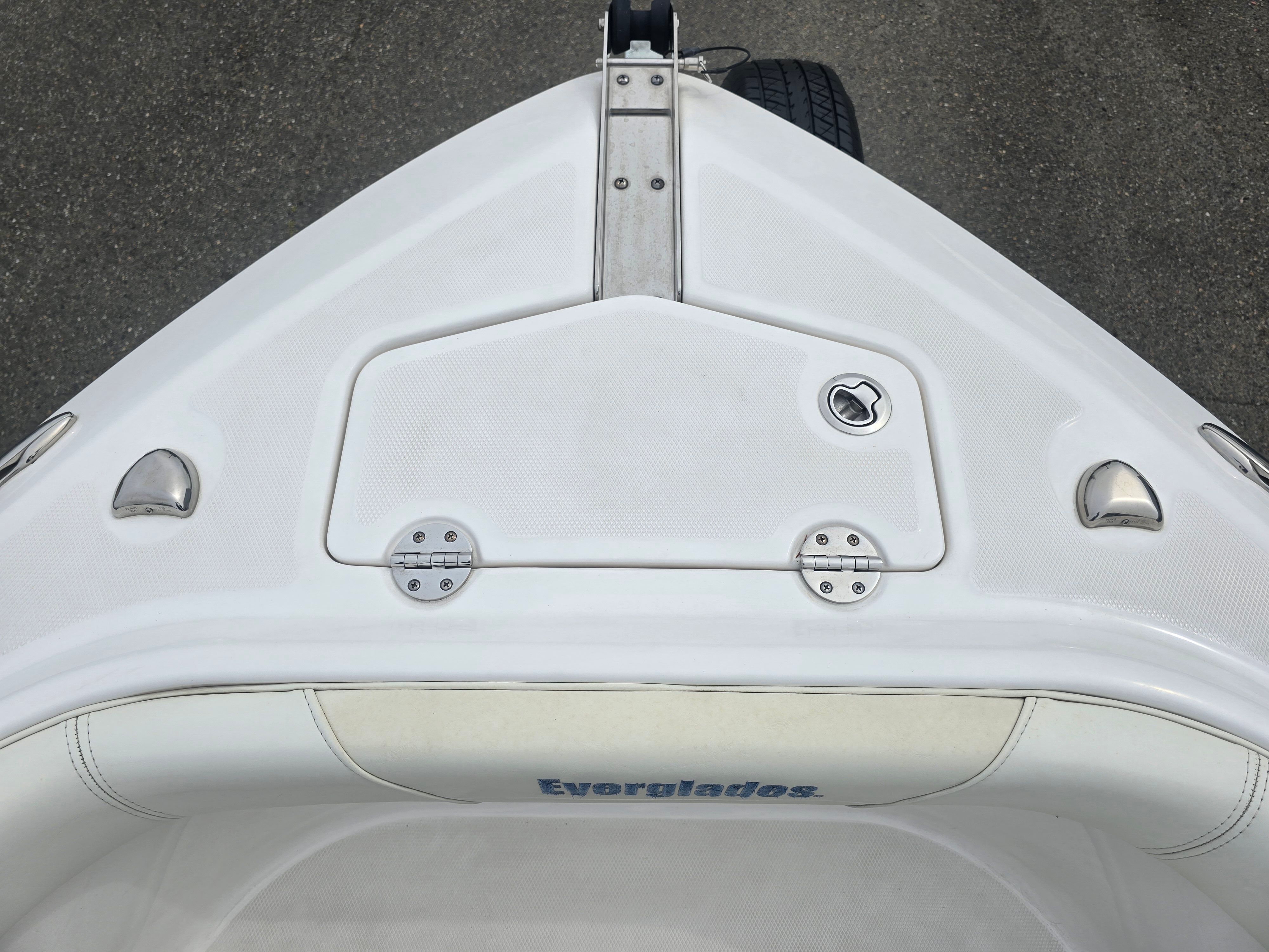 Bow view of a 2017 Everglades 230 Dual Console with storage compartment and stainless steel fittings.