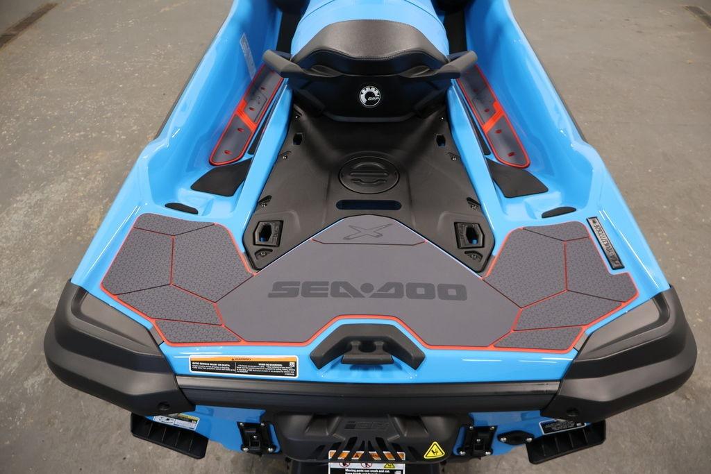 2026 Sea-Doo RXT-X 325 in blue, rear view showcasing seating and deck design.