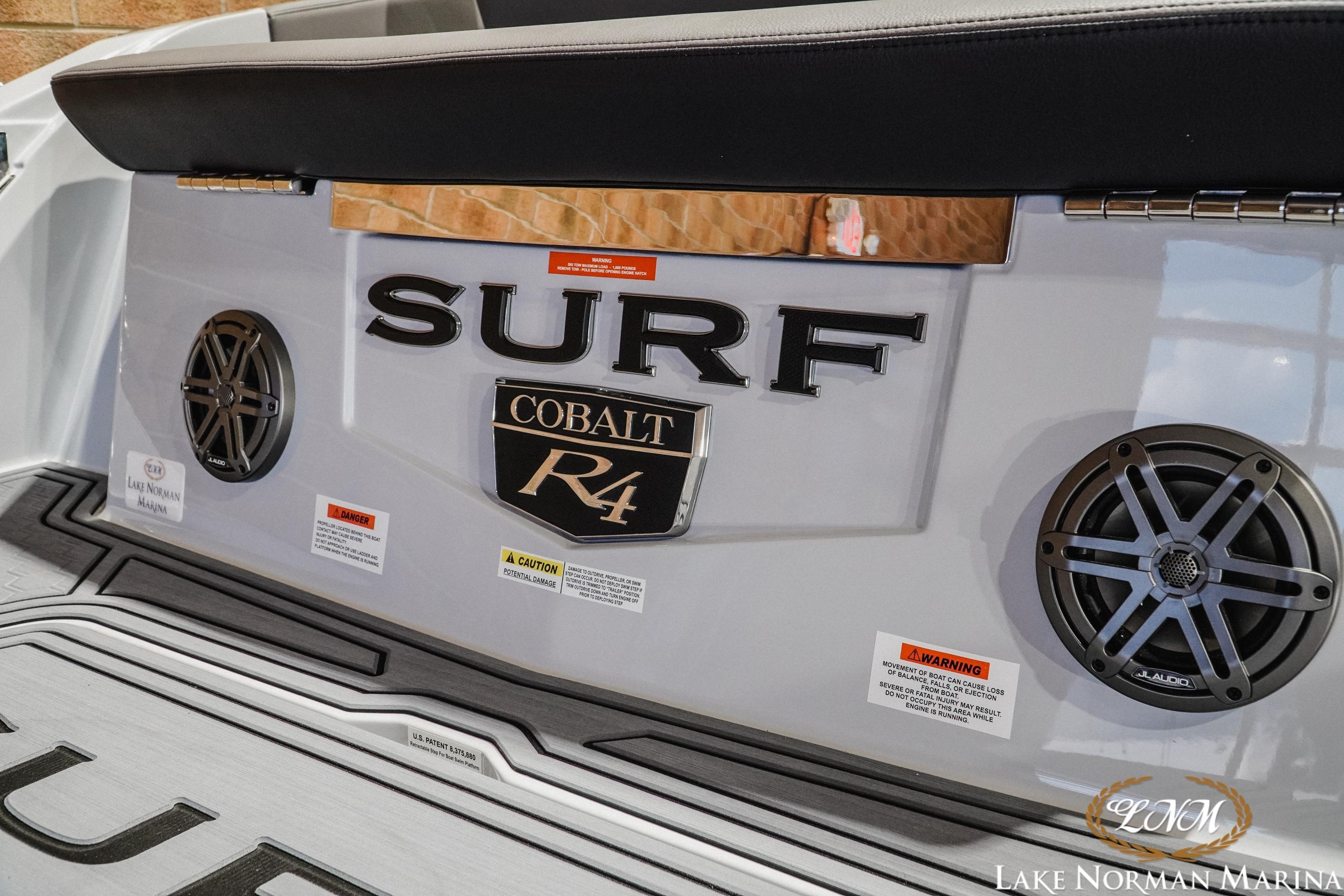 2026 Cobalt R4 Surf boat rear view with speakers and branding.