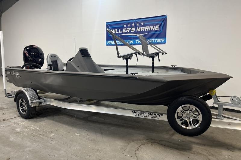 2026 SeaArk Flex 19 Pro boat on trailer at Miller's Marine showroom.