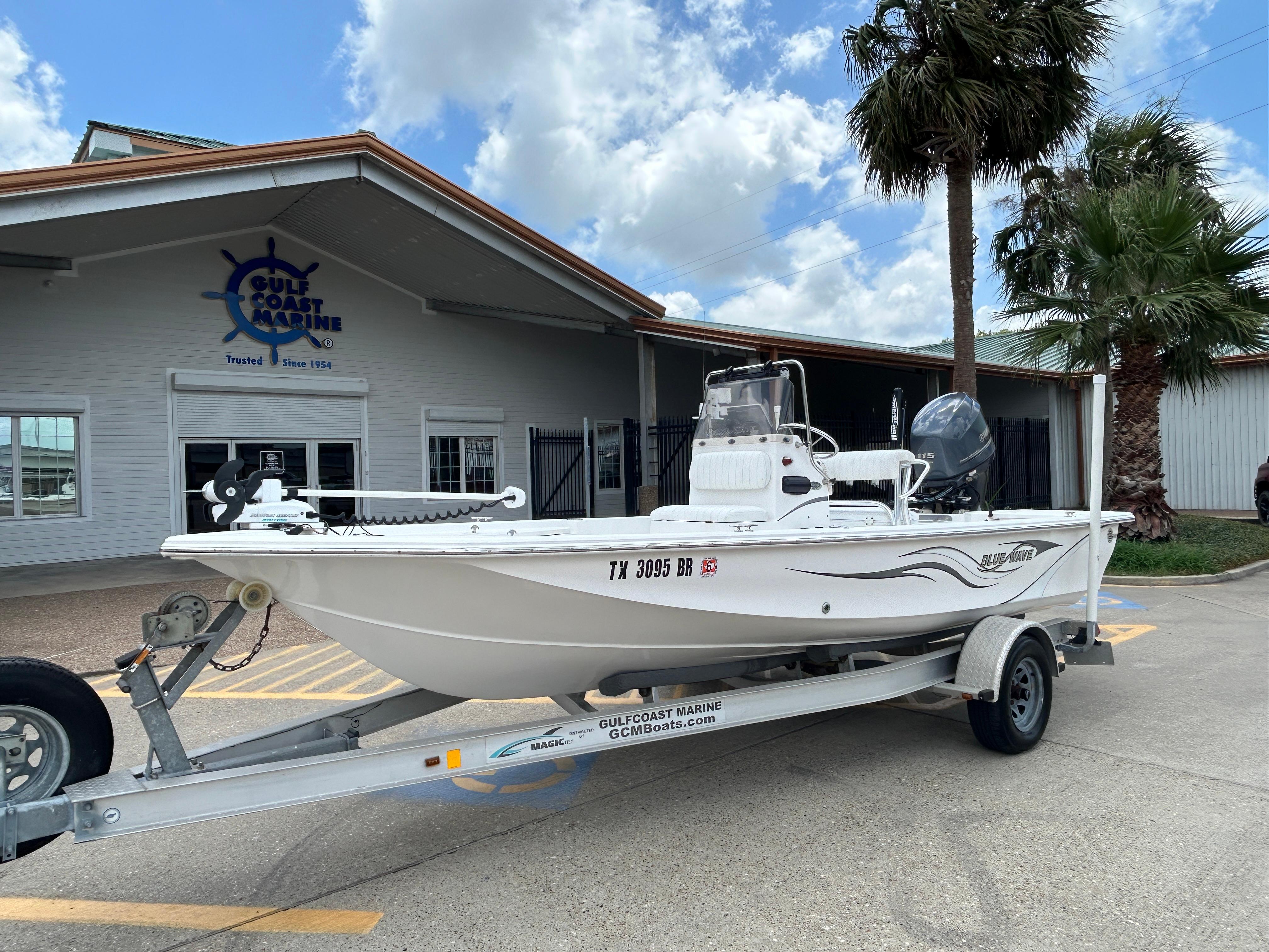 2012 Blue Wave 1900 STL boat on trailer at Gulf Coast Marine dealership.