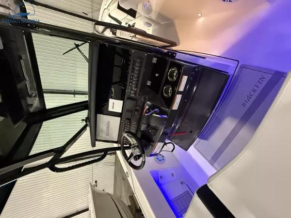 2025 Blackfin 272CC boat interior with modern dashboard and steering wheel.