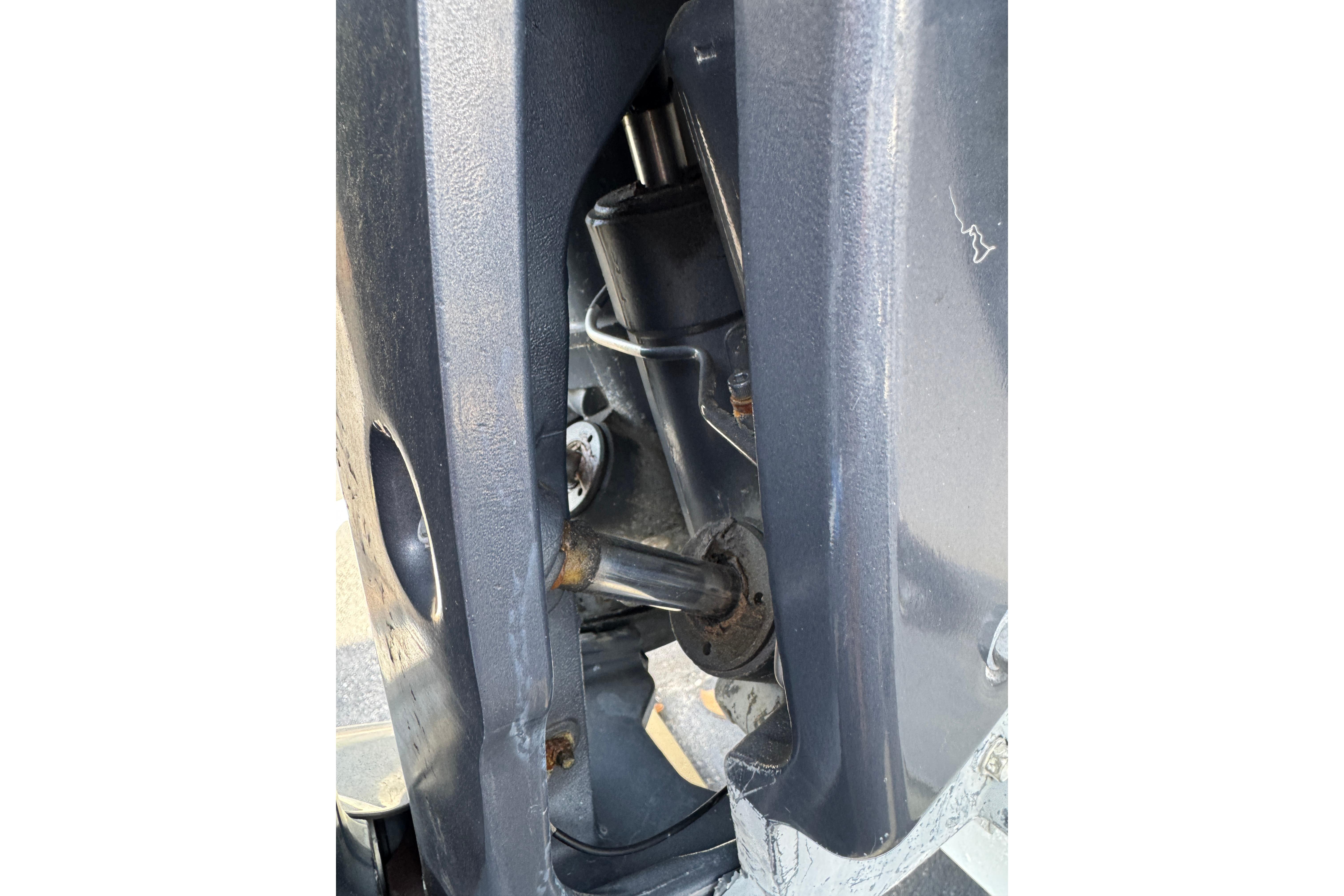 Close-up of 2018 Hurricane SunDeck 2400 OB boat engine components.