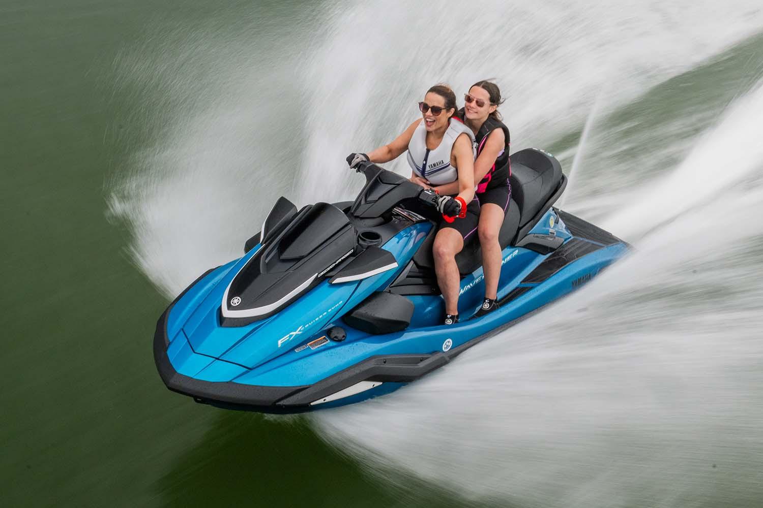 Manufacturer Provided Image: Two people riding a 2026 Yamaha WaveRunner FX Cruiser SVHO on water.