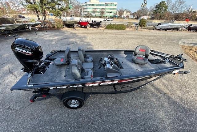 2026 Tracker Pro Team 175 boat with Mercury engine, parked outdoors.