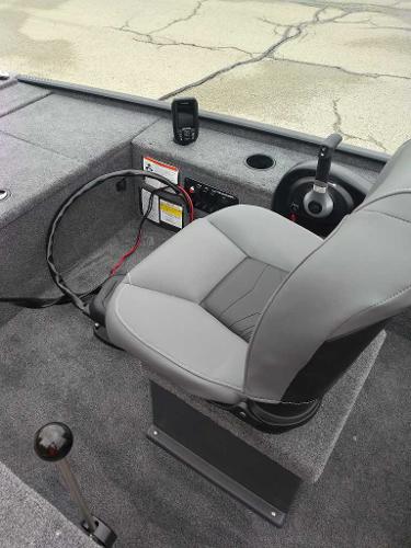 2025 Tracker Panfish 17 boat interior with gray seating and control panel.