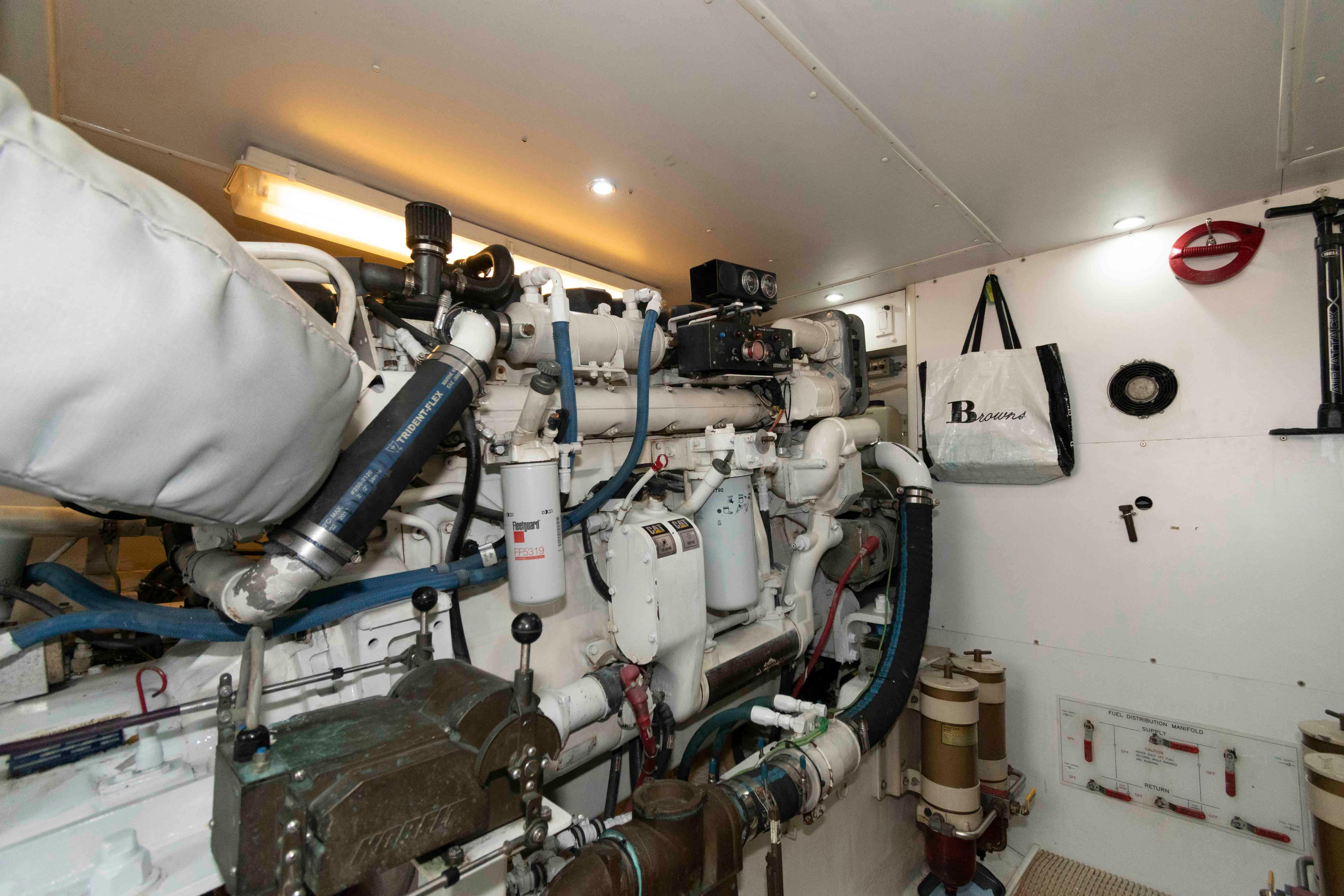 Engine room of 1999 West Bay 58 Sonship Pilothouse MY with mechanical components.