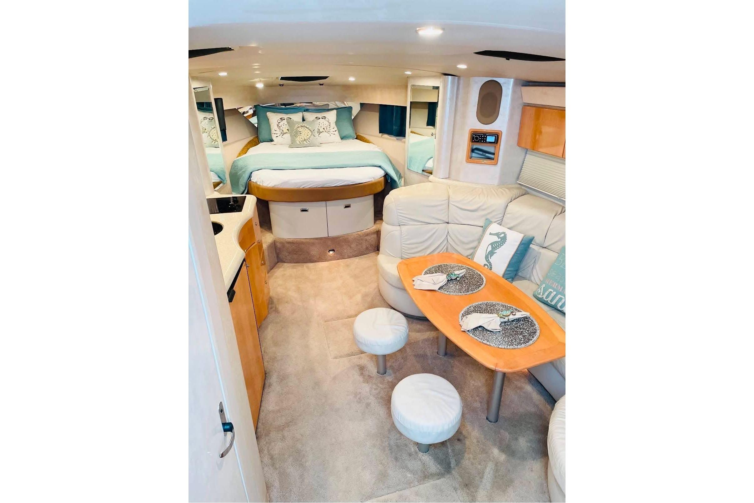 Luxurious interior of a 2003 Formula 40 Performance Cruiser with cozy seating and elegant decor.