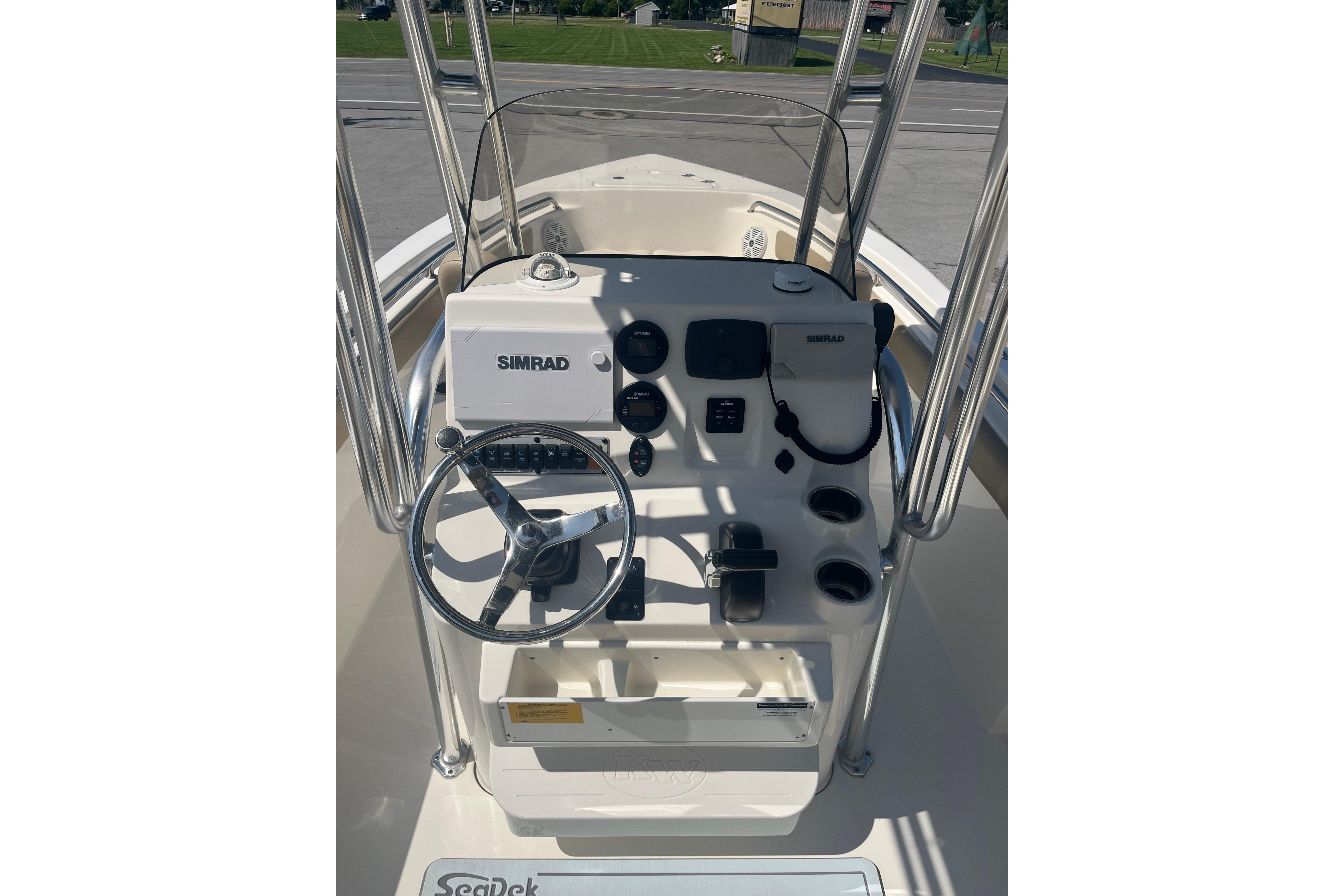 2017 Key West 203 FS boat console with Simrad navigation system and steering wheel.