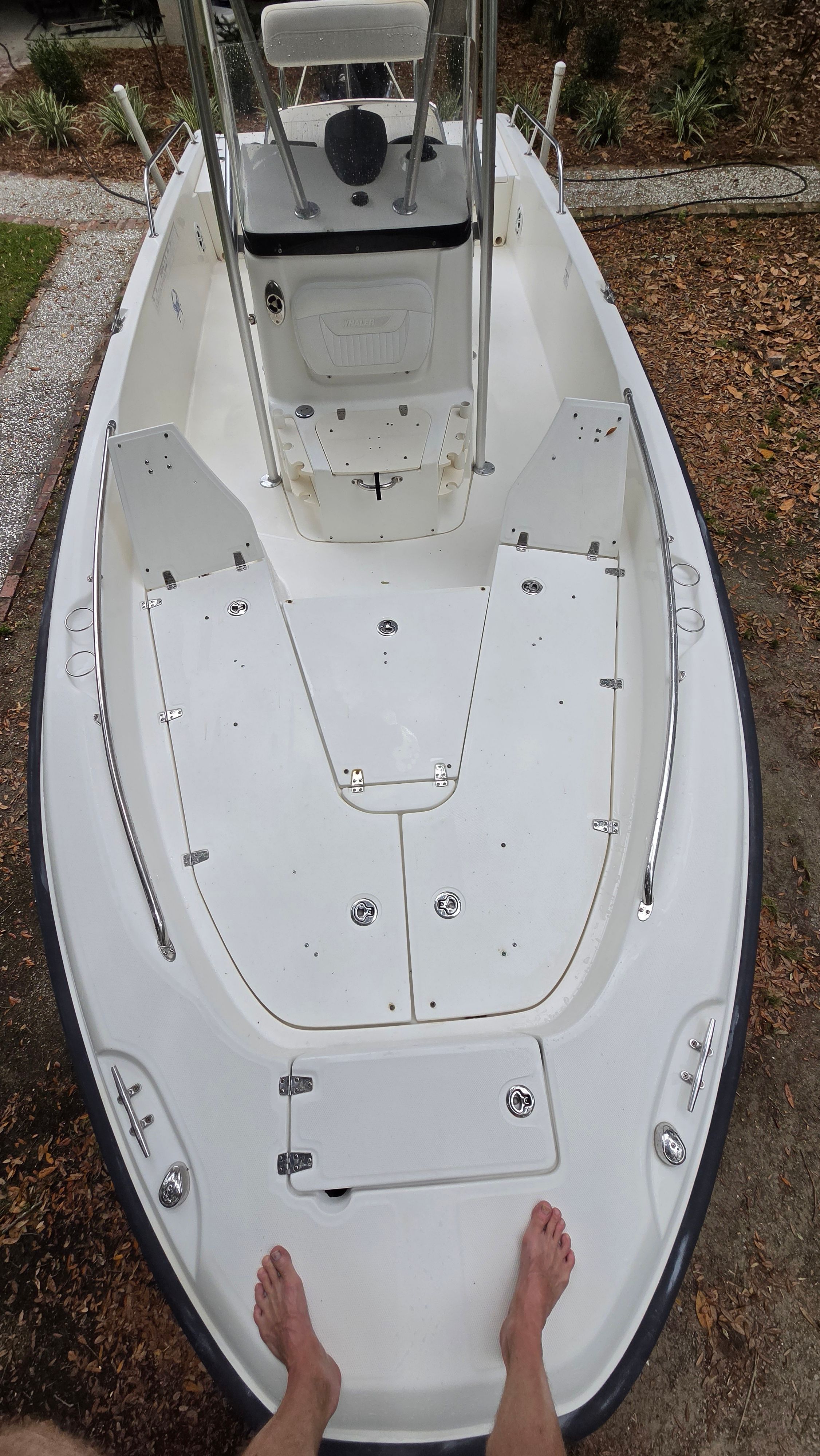 The image shows the deck of a 2008 Boston Whaler 230 Dauntless. It is clean and spacious.
