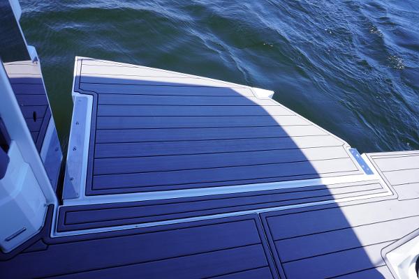 Deck of 2020 Cruisers Yachts 38 GLS OB, overlooking water.