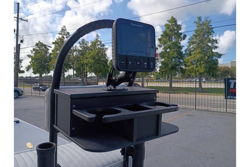 Fishfinder mounted on a Pelican Ambush 2013 boat, with cup holders and storage.