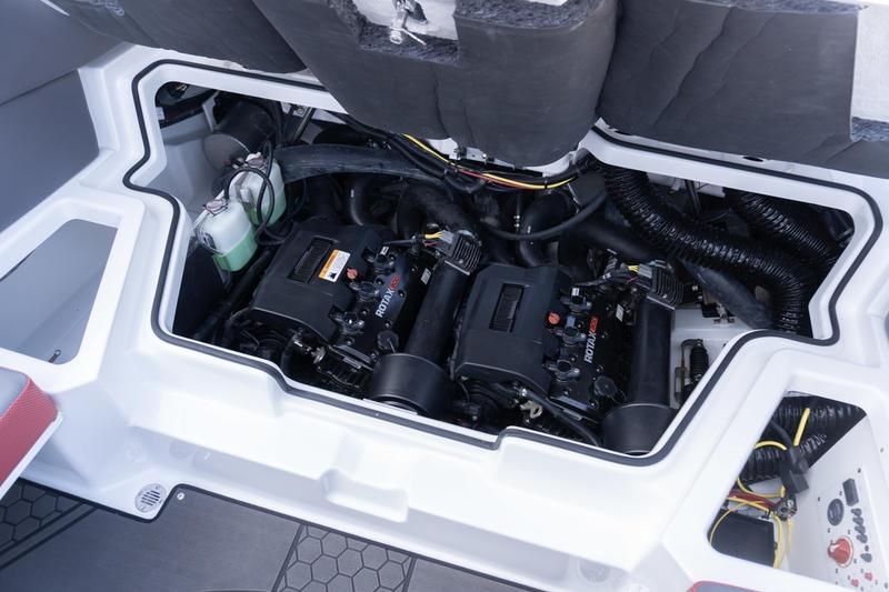 Engine compartment of 2026 Scarab 255 LX Wake boat, showcasing dual Rotax engines.