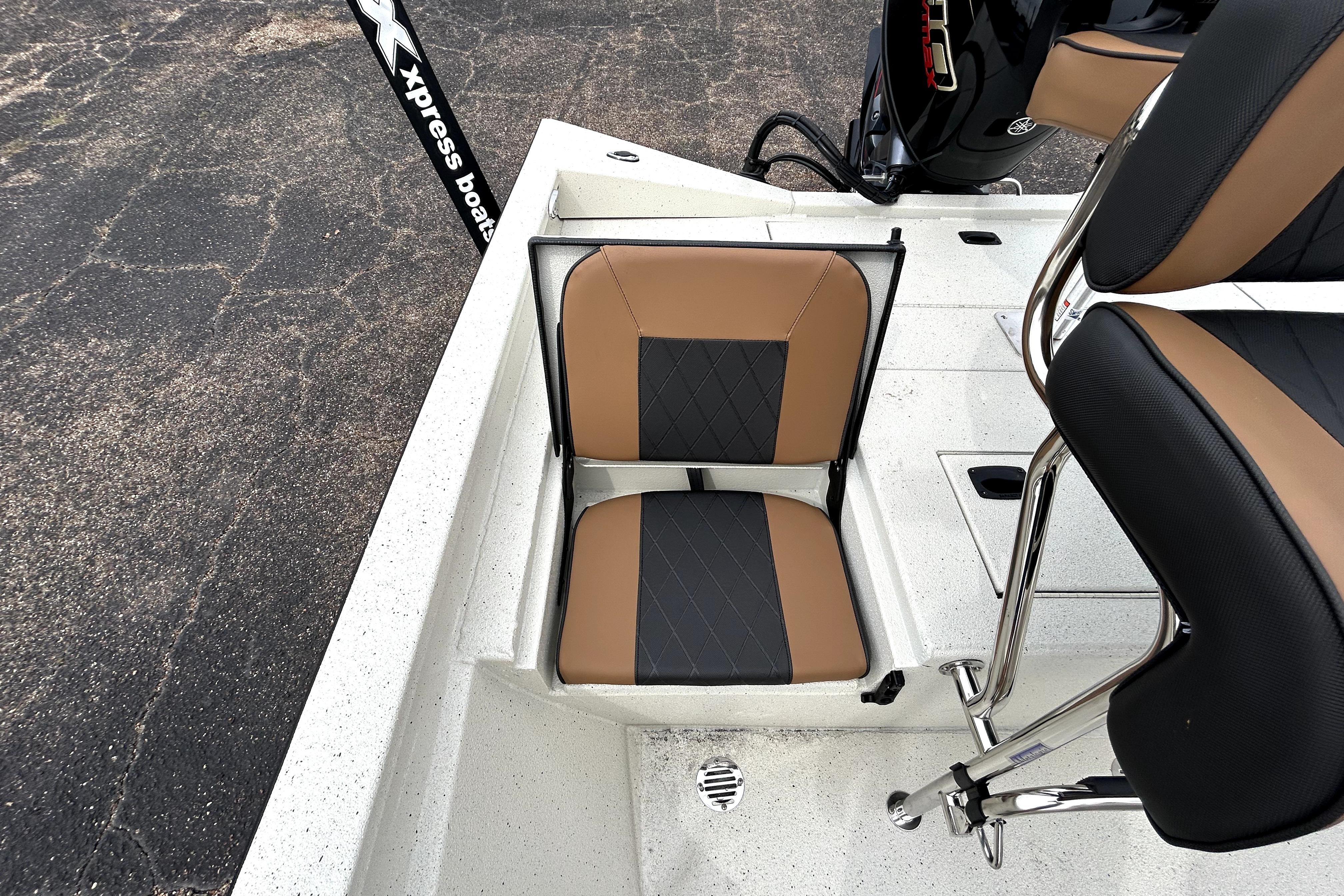 2026 Xpress H20B Bay boat with tan and black seating, featuring sleek design.