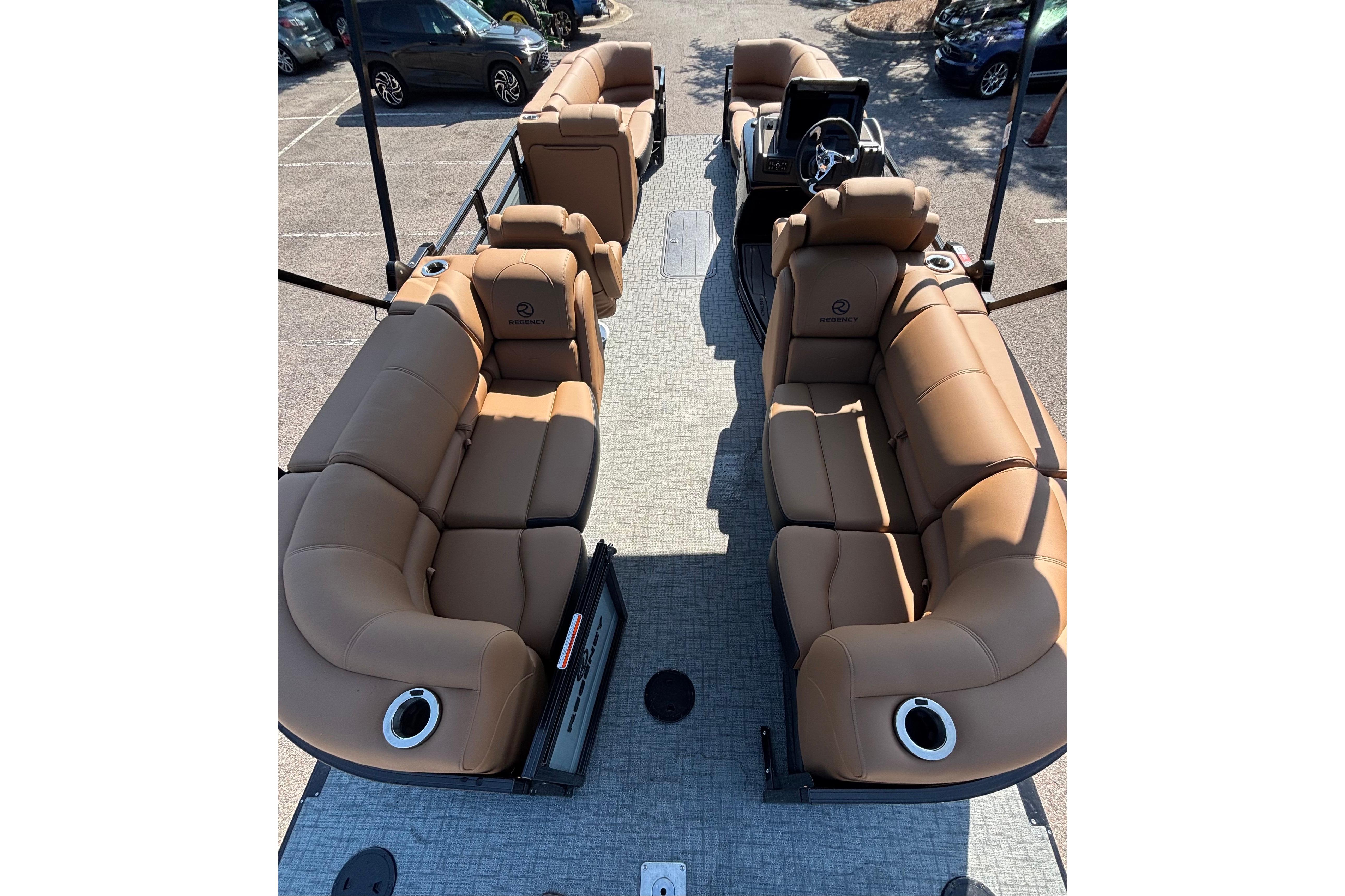 2026 Regency 230 DL pontoon boat with luxurious tan seating and modern design.