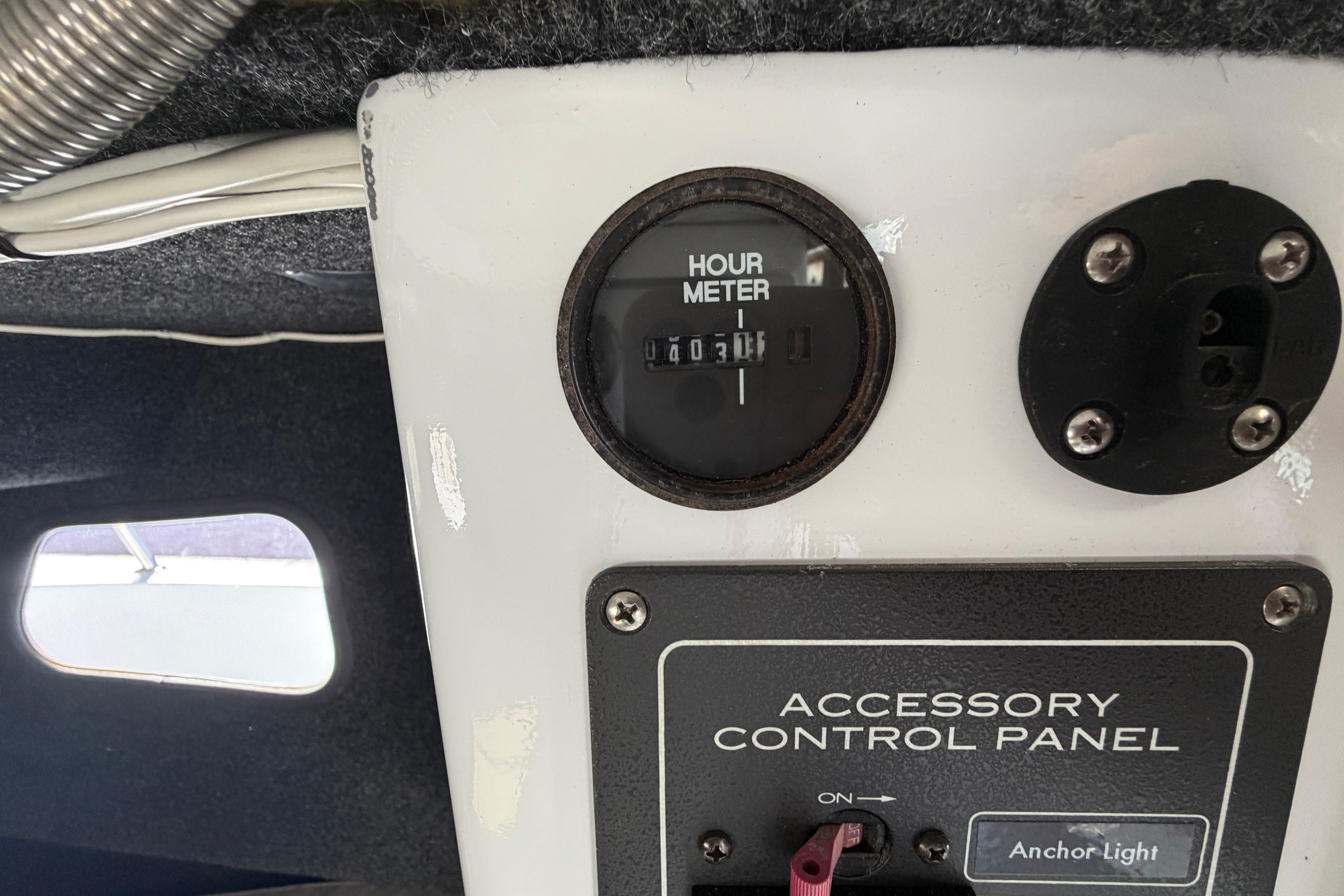 Hour meter and accessory control panel on 1986 Radon 21 Sport boat.