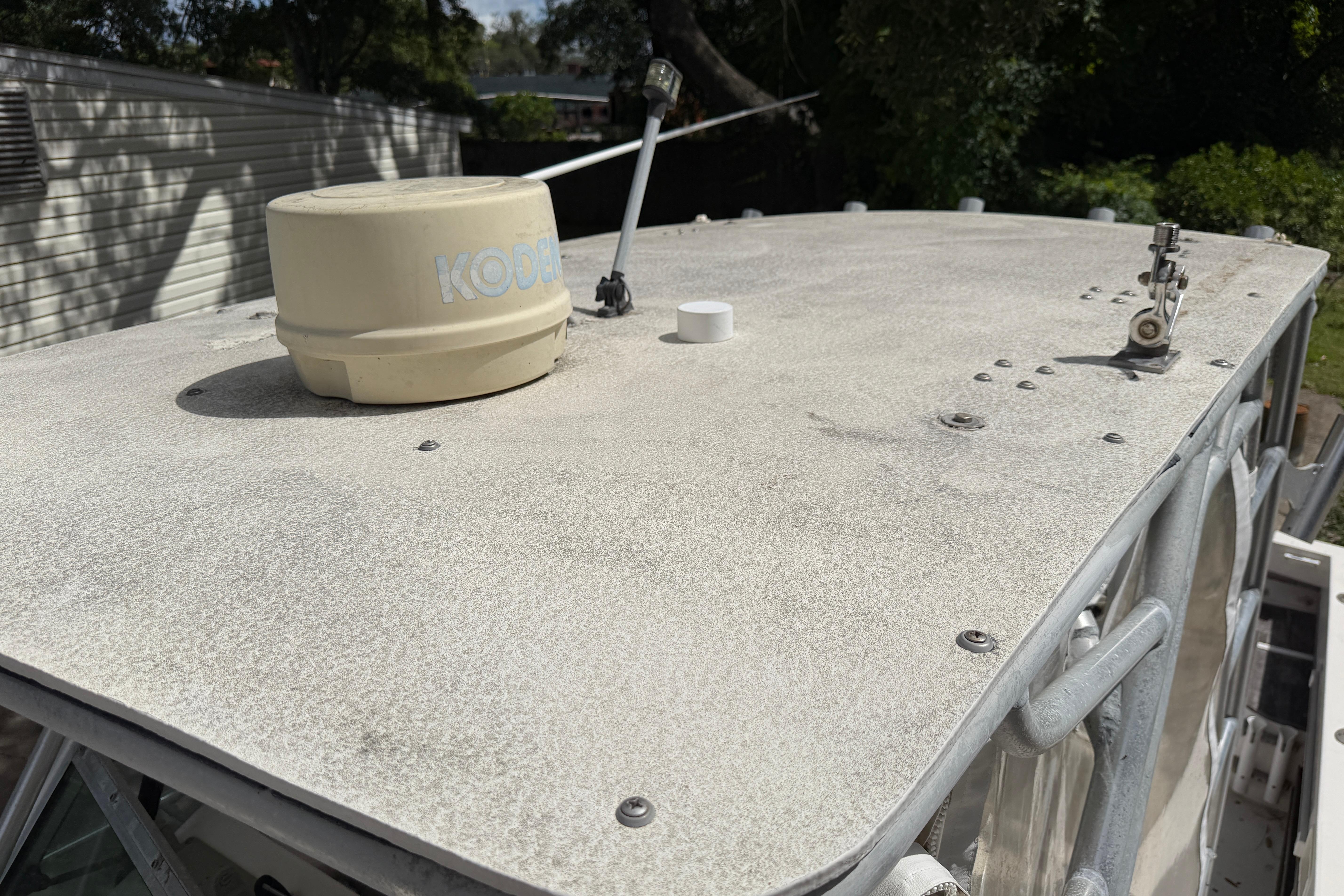 1987 Grady-White Seafarer 226 boat roof with radar equipment and metal fittings.
