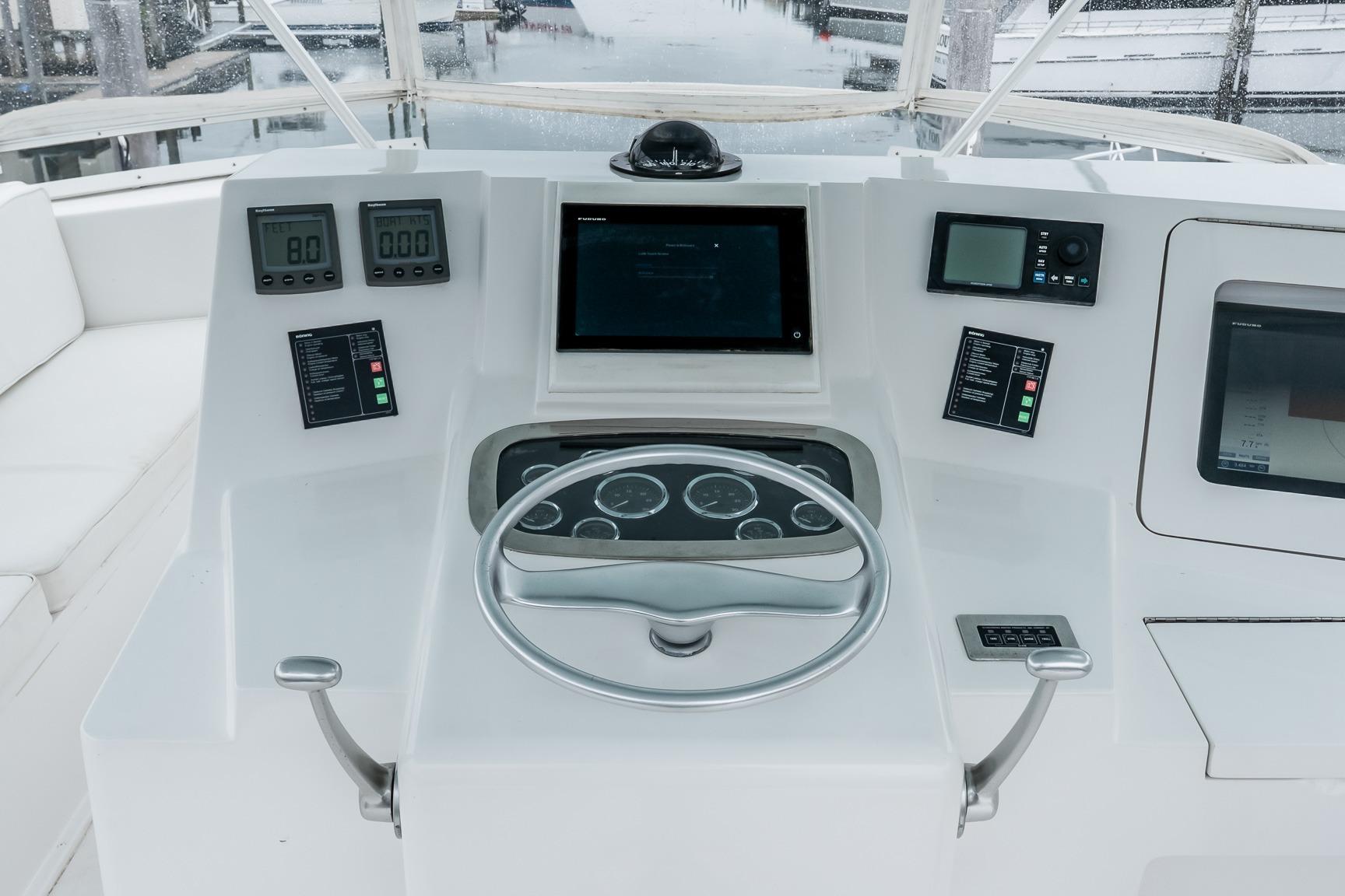 Helm of 2000 Viking 50' Convertible yacht with modern navigation instruments.