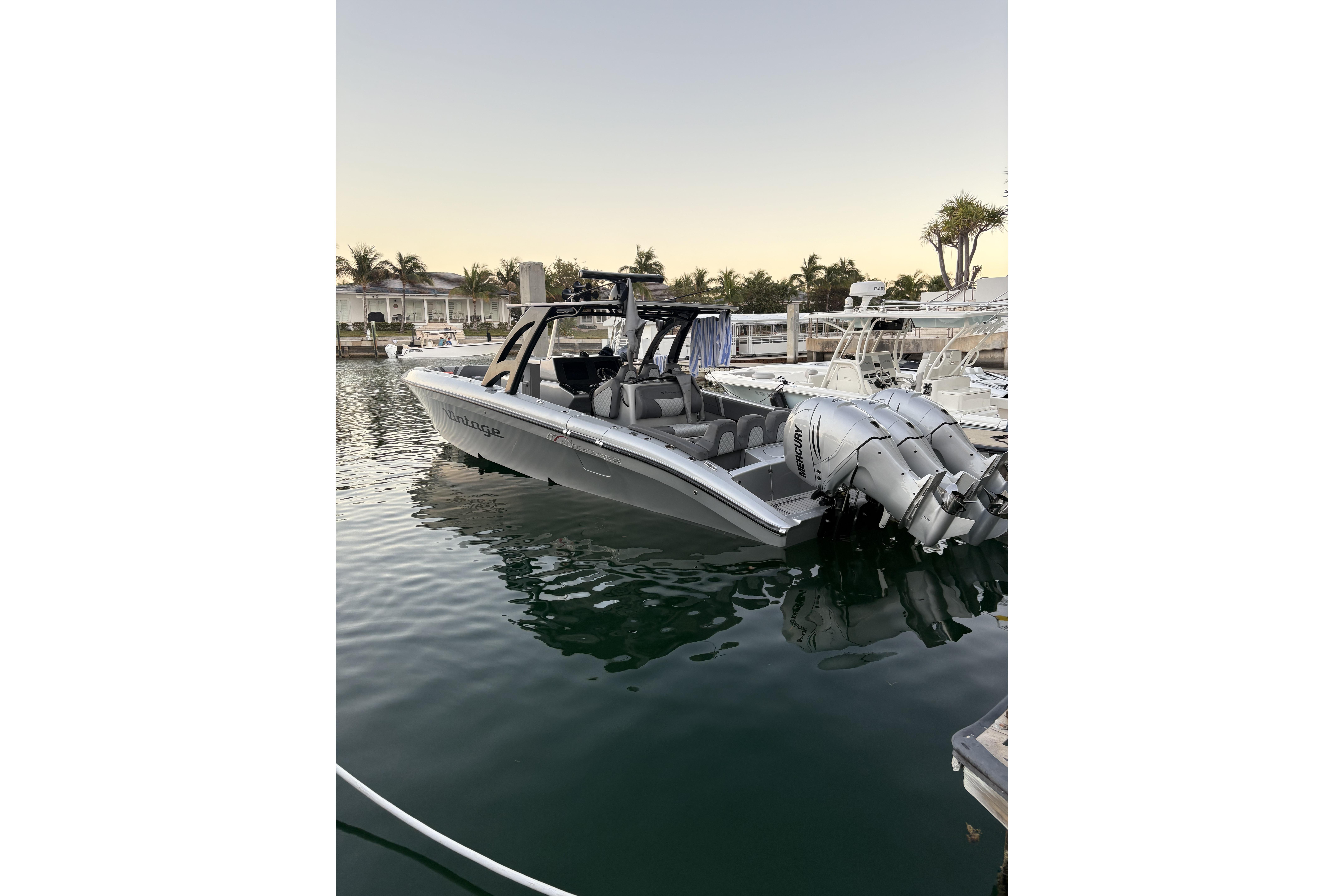 2021 Midnight Express 37 Open boat docked, featuring sleek design and powerful engines.
