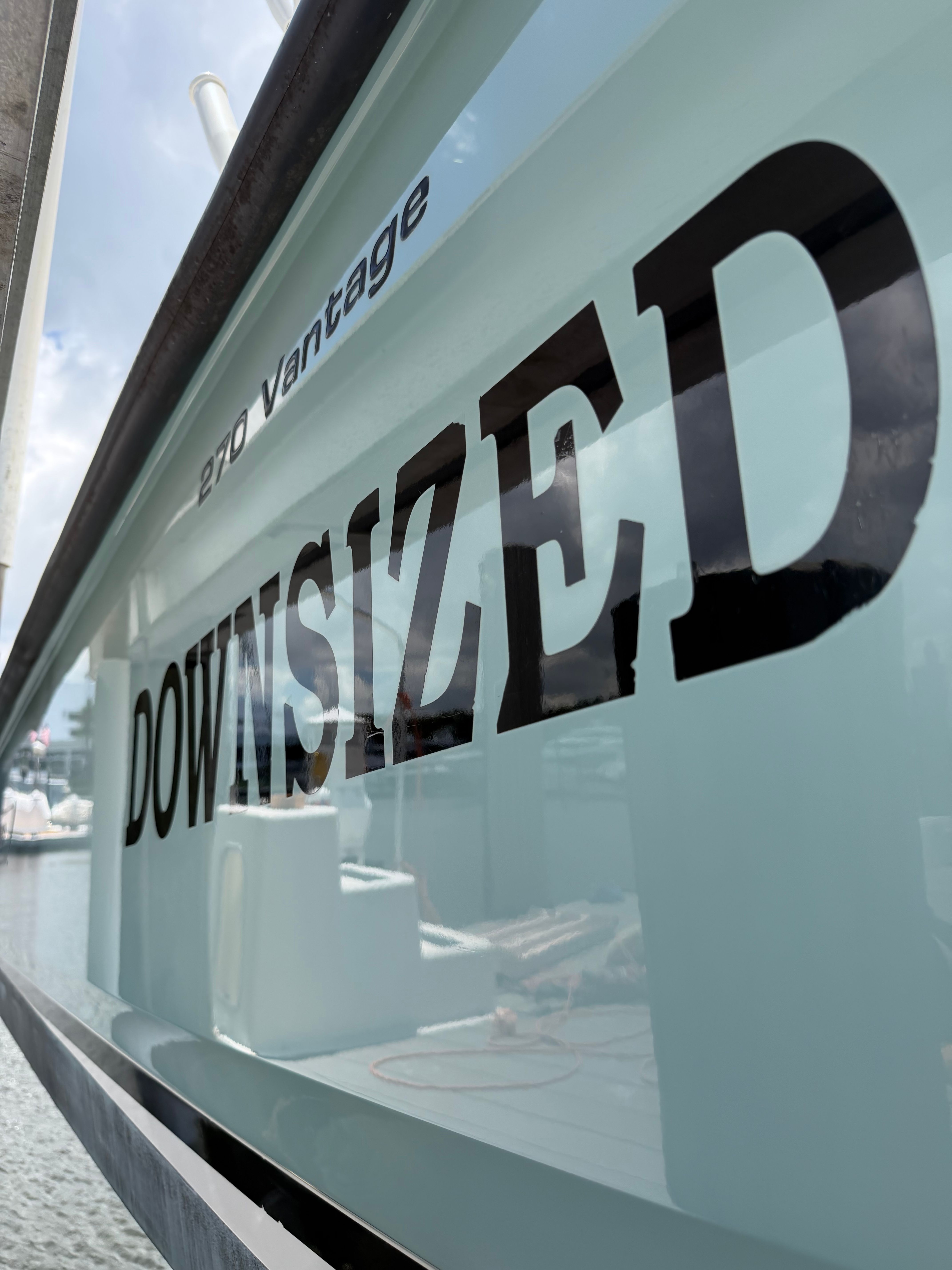 Boston Whaler 270 Vantage 2016 with "DOWNSIZED" lettering on hull.