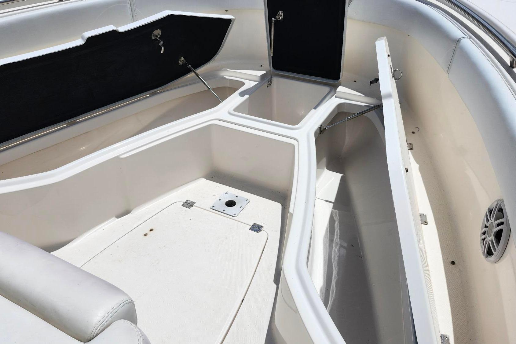 2015 Robalo R300 Center Console boat interior with open storage compartments.