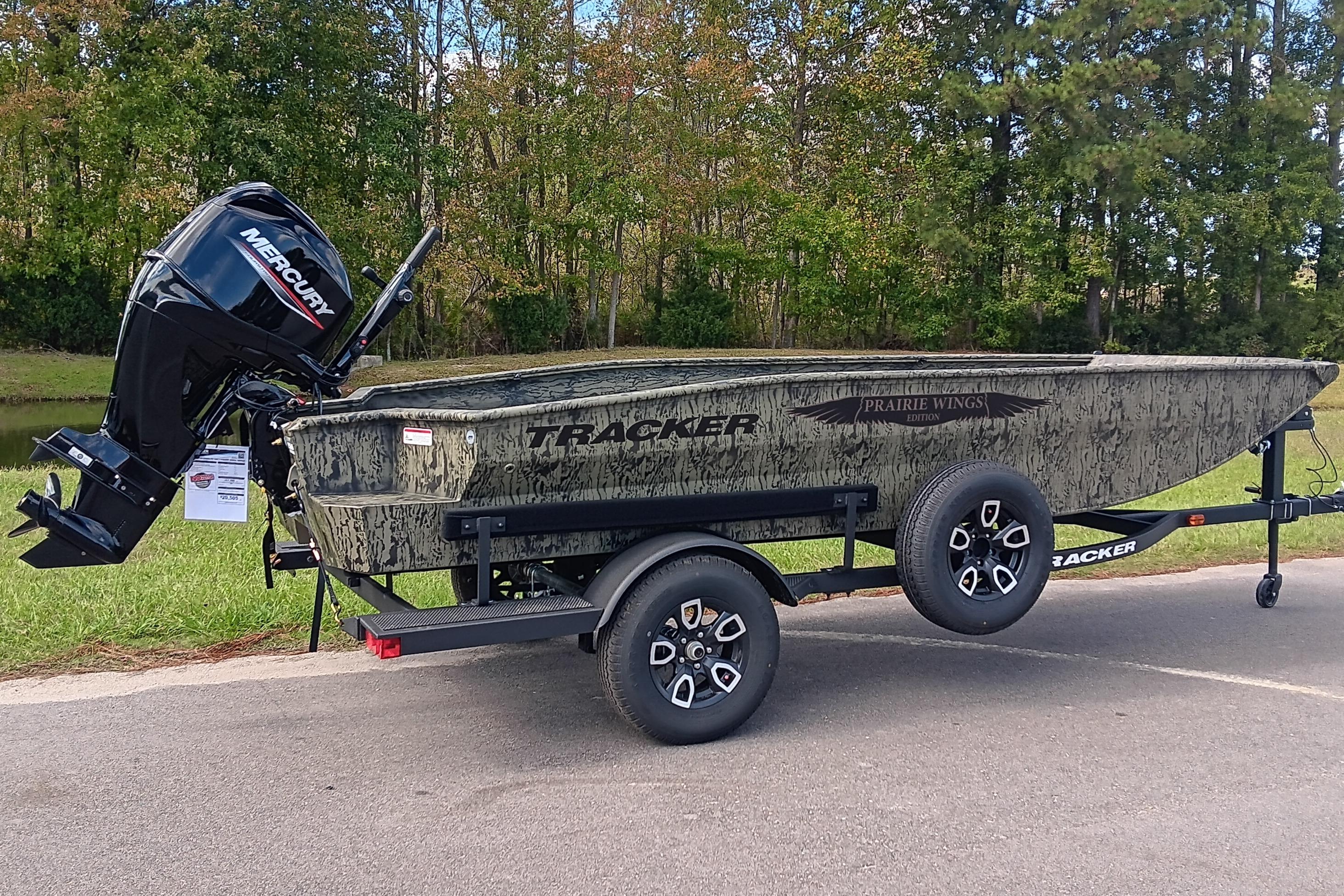 2026 Tracker Grizzly 1650 T Prairie Wings Edition boat on trailer, outdoors.
