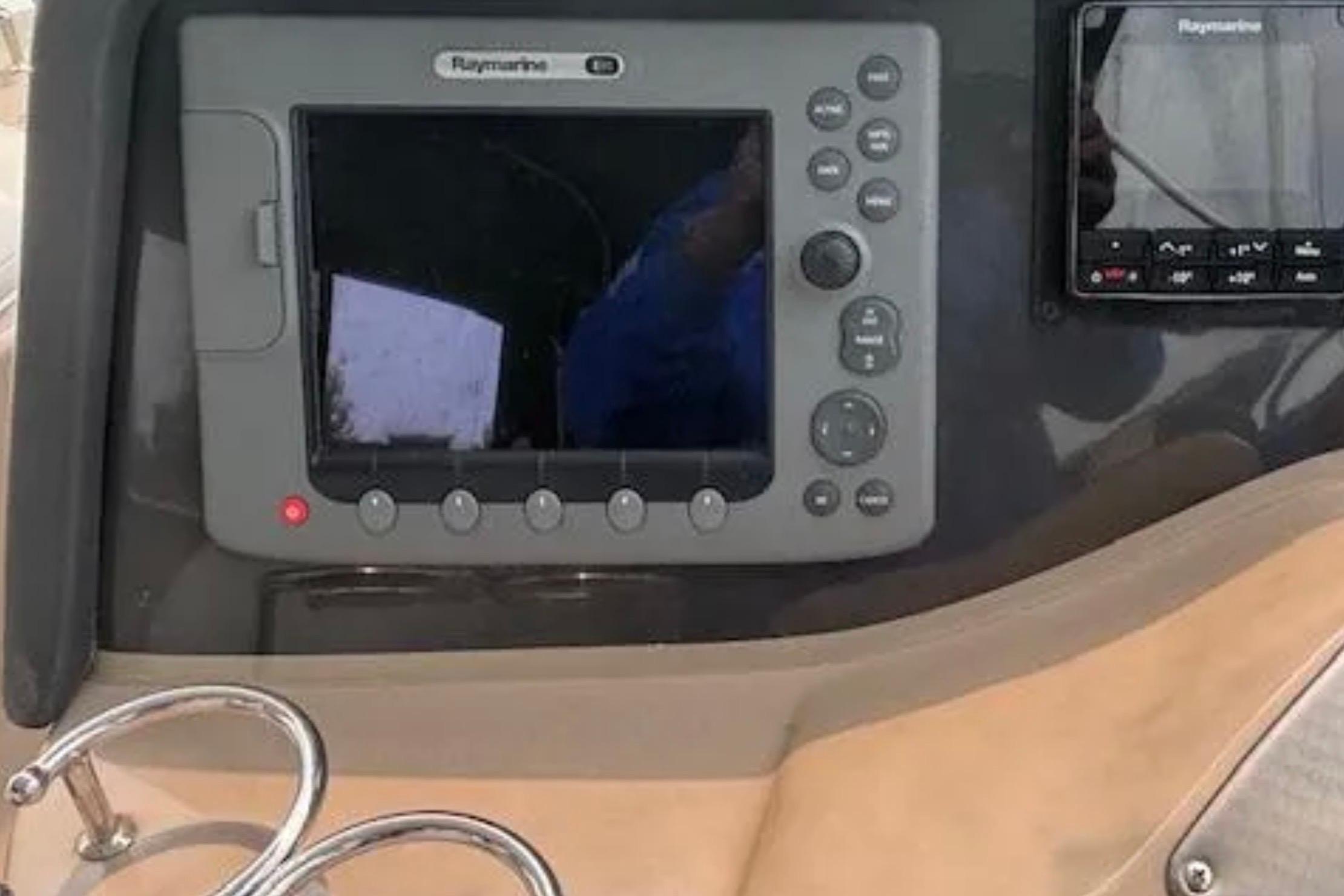 Raymarine navigation system on 2007 Four Winns 378 Vista boat dashboard.