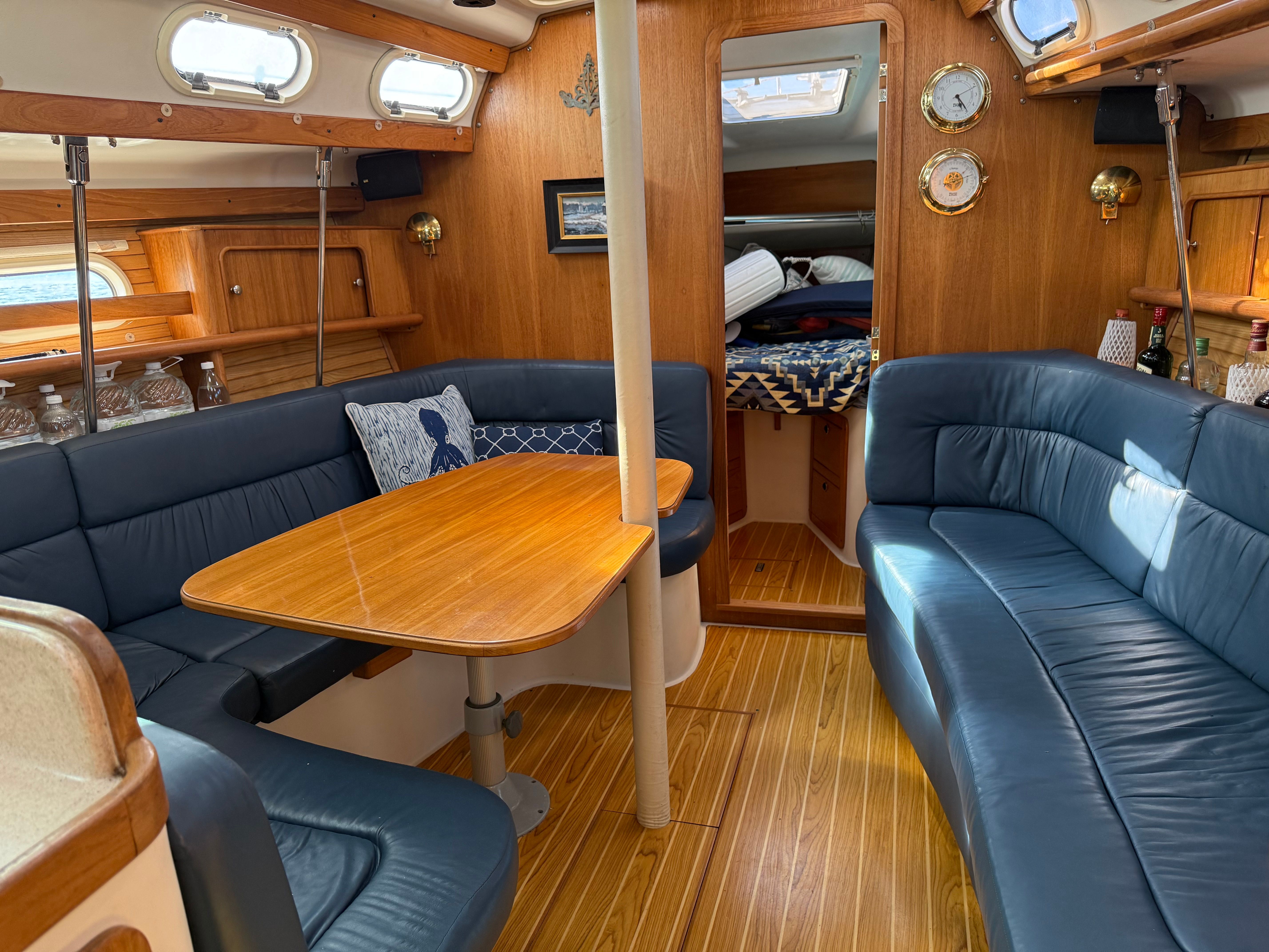 Interior of a 2003 Catalina 380 yacht with blue upholstery.