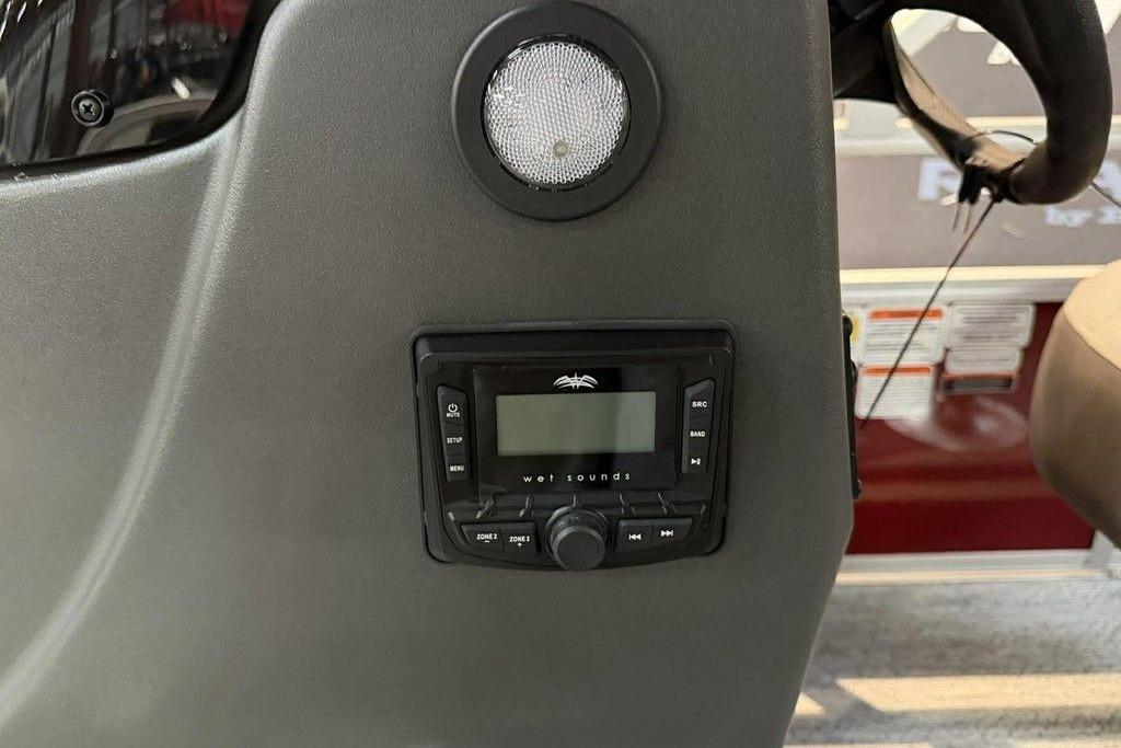 2026 Sun Tracker Bass Buggy 18 DLX dashboard with audio system and speaker.