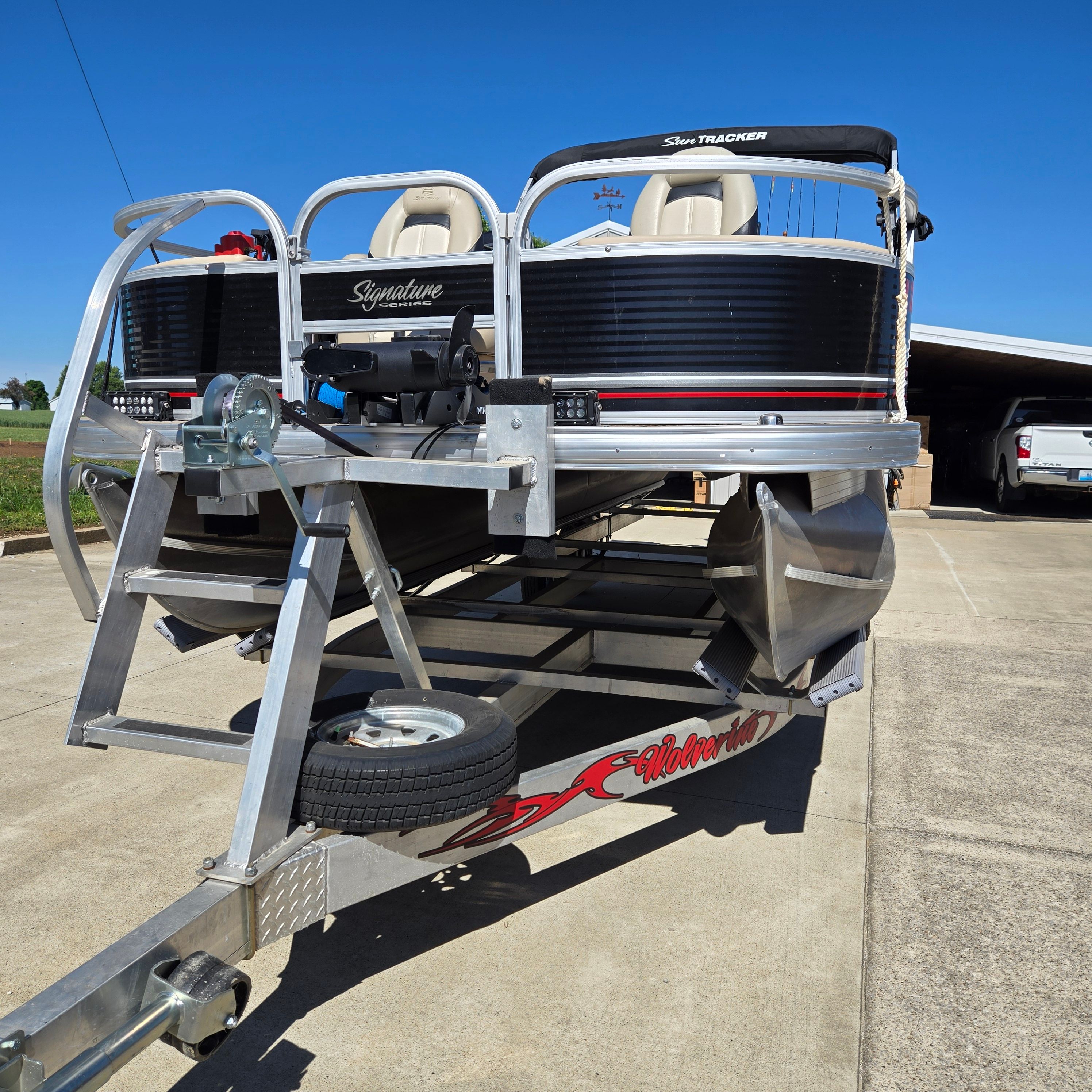 2012 Sun Tracker Fishin' Barge 24 DLX on trailer, ready for adventure.