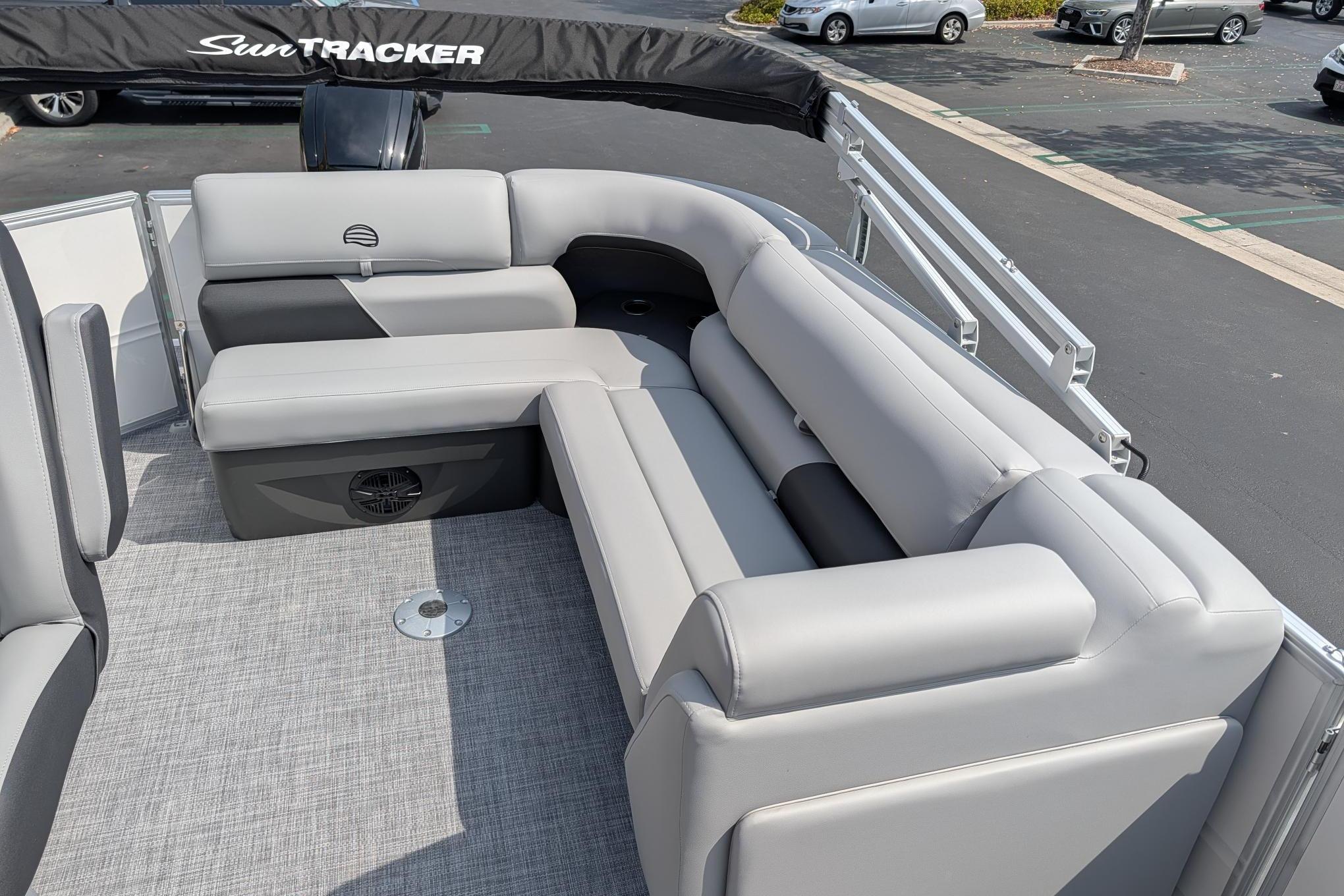 2026 Sun Tracker Party Barge 20 DLX with spacious gray seating and sleek design.