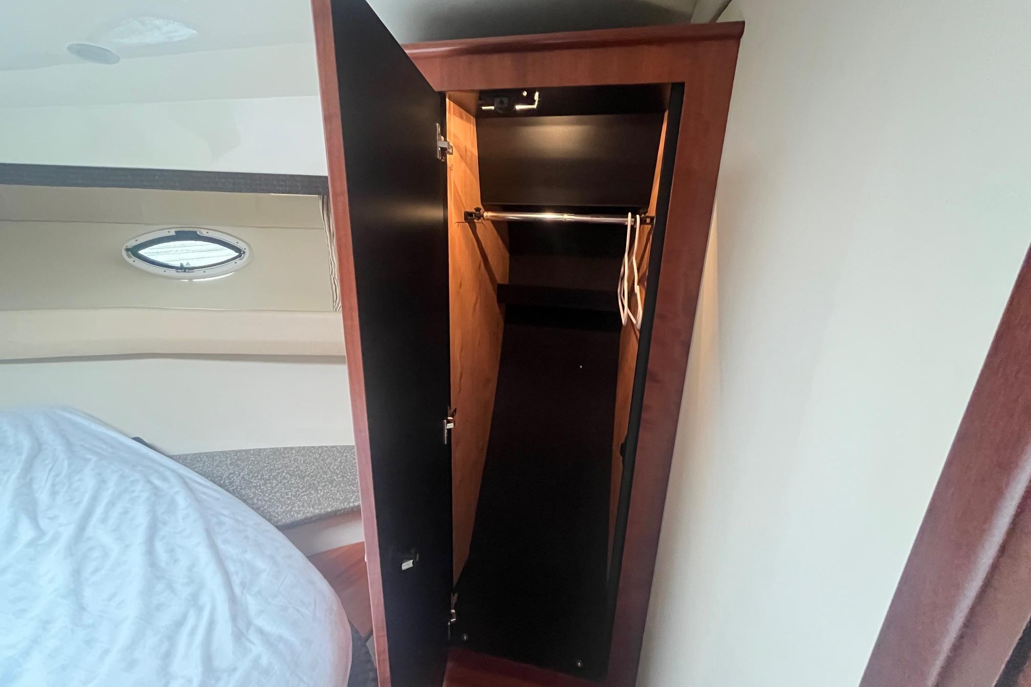 Open closet in 2010 Monterey 400 Sport Yacht cabin interior.