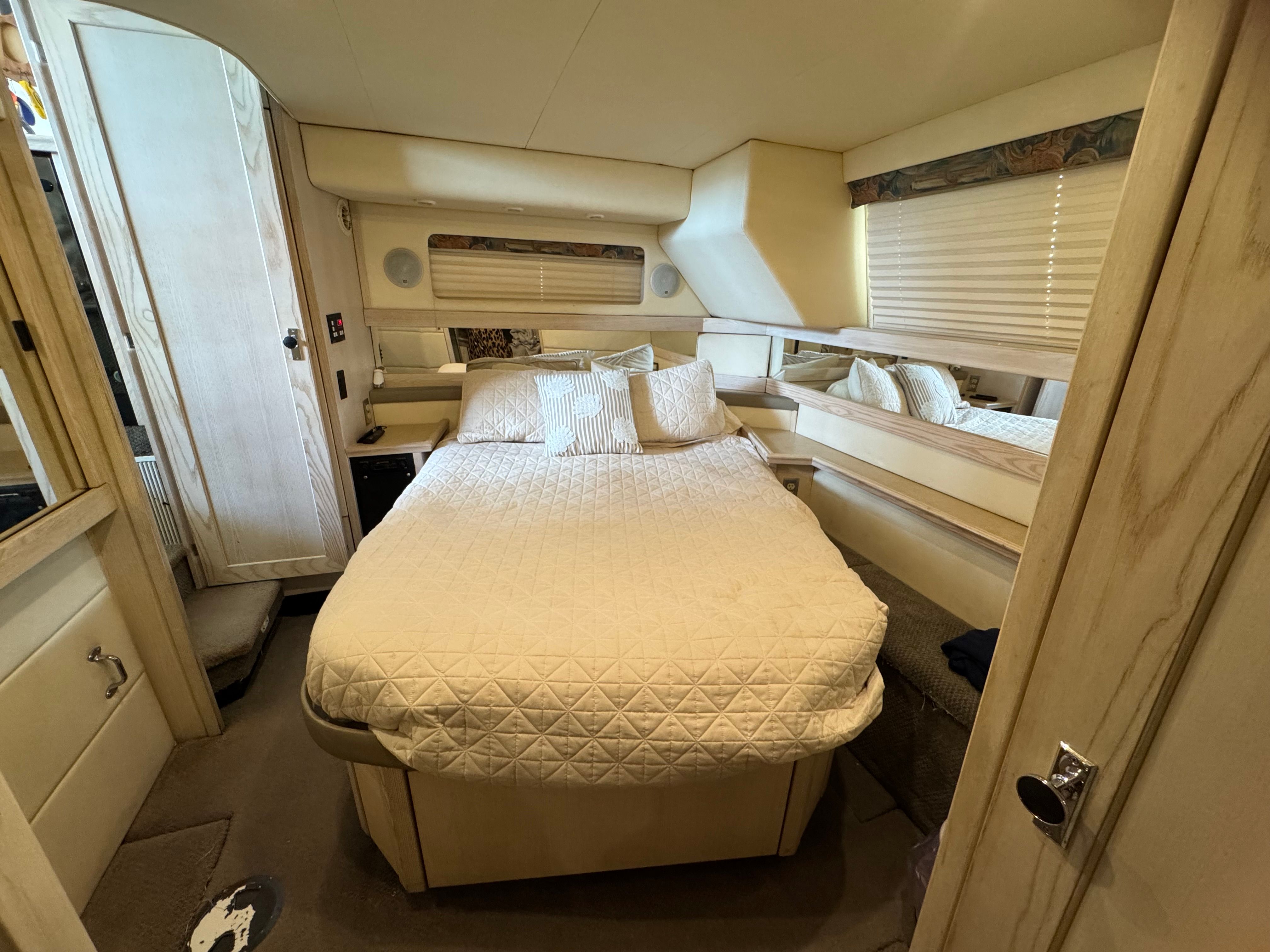 Interior of Bayliner 3587 yacht featuring cozy bedroom.