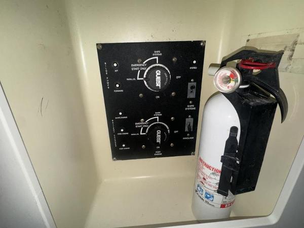 Control panel and fire extinguisher on 2005 Four Winns 298 Vista boat.