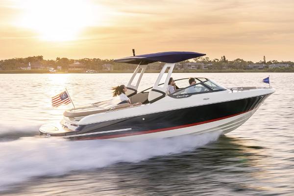 Manufacturer Provided Image: 2025 Chris-Craft Sportster 25 boat cruising at sunset on a serene lake.