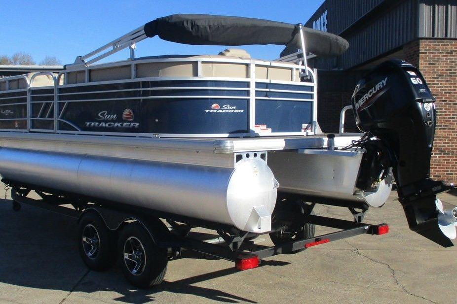 2022 Sun Tracker Party Barge 20 DLX pontoon boat with Mercury engine on trailer.