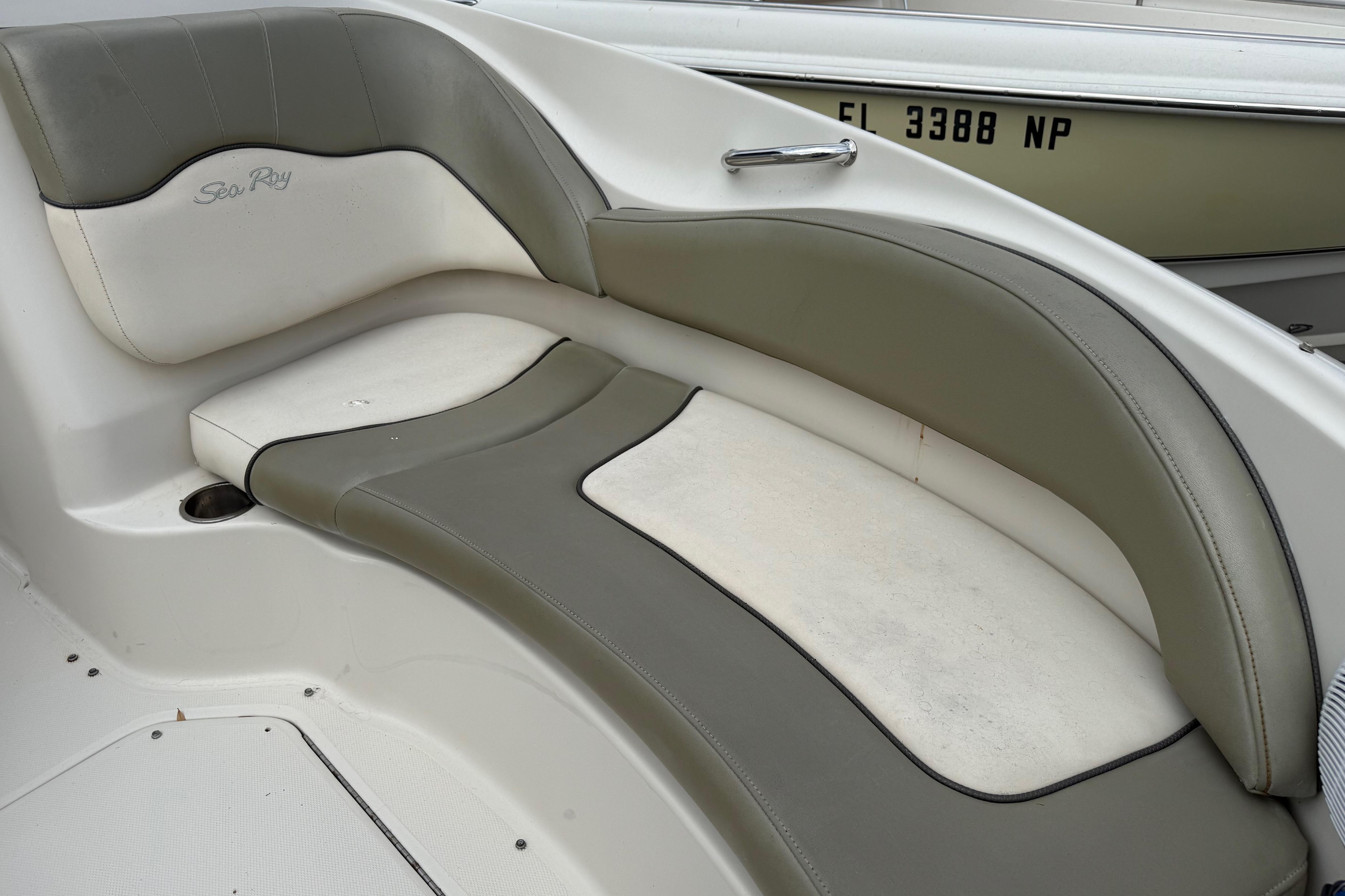 2005 Sea Ray 220 Sundeck boat interior seating with gray and white upholstery.