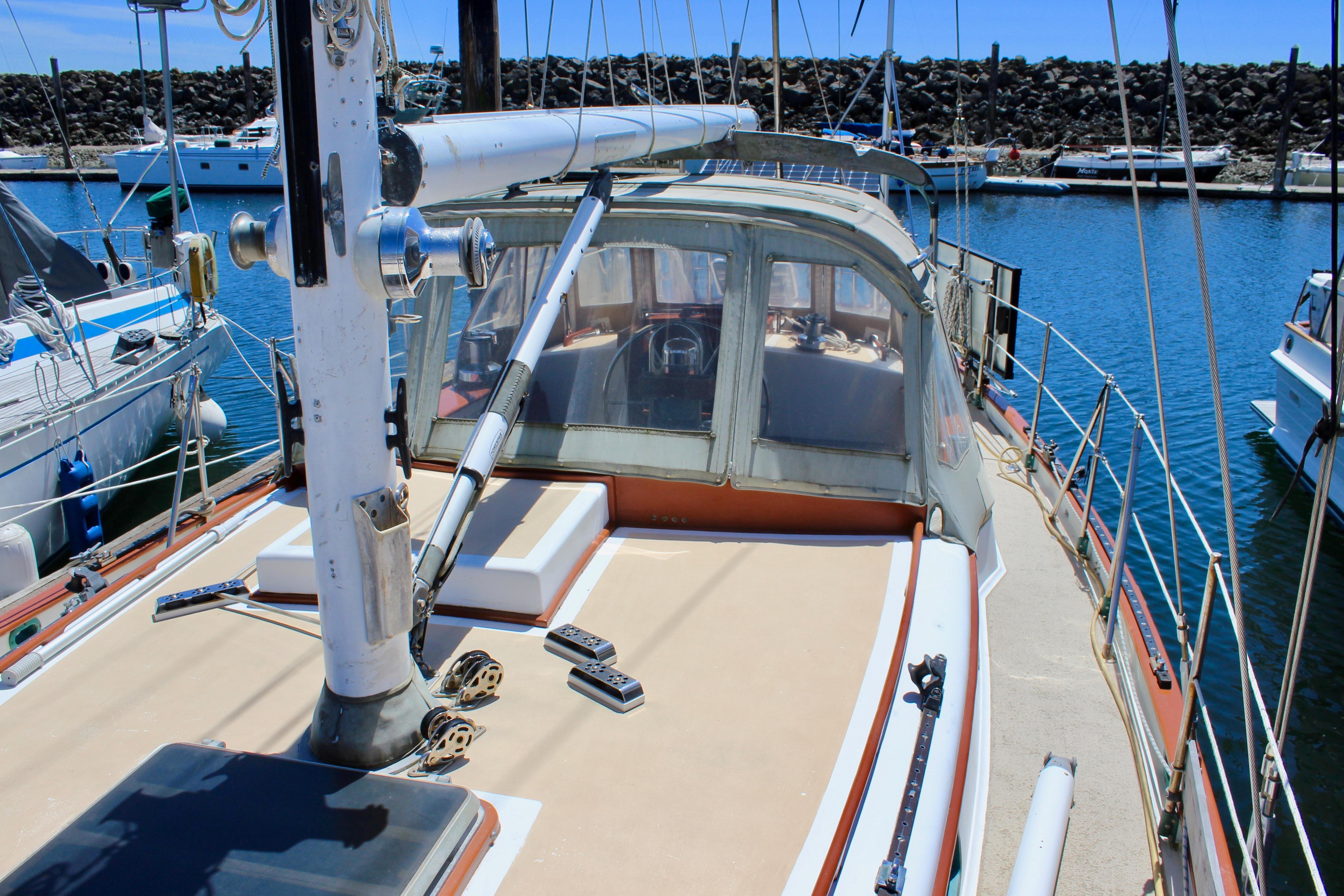 1981 Kelly Peterson 46 sailboat docked in a marina, showcasing deck and cockpit area.