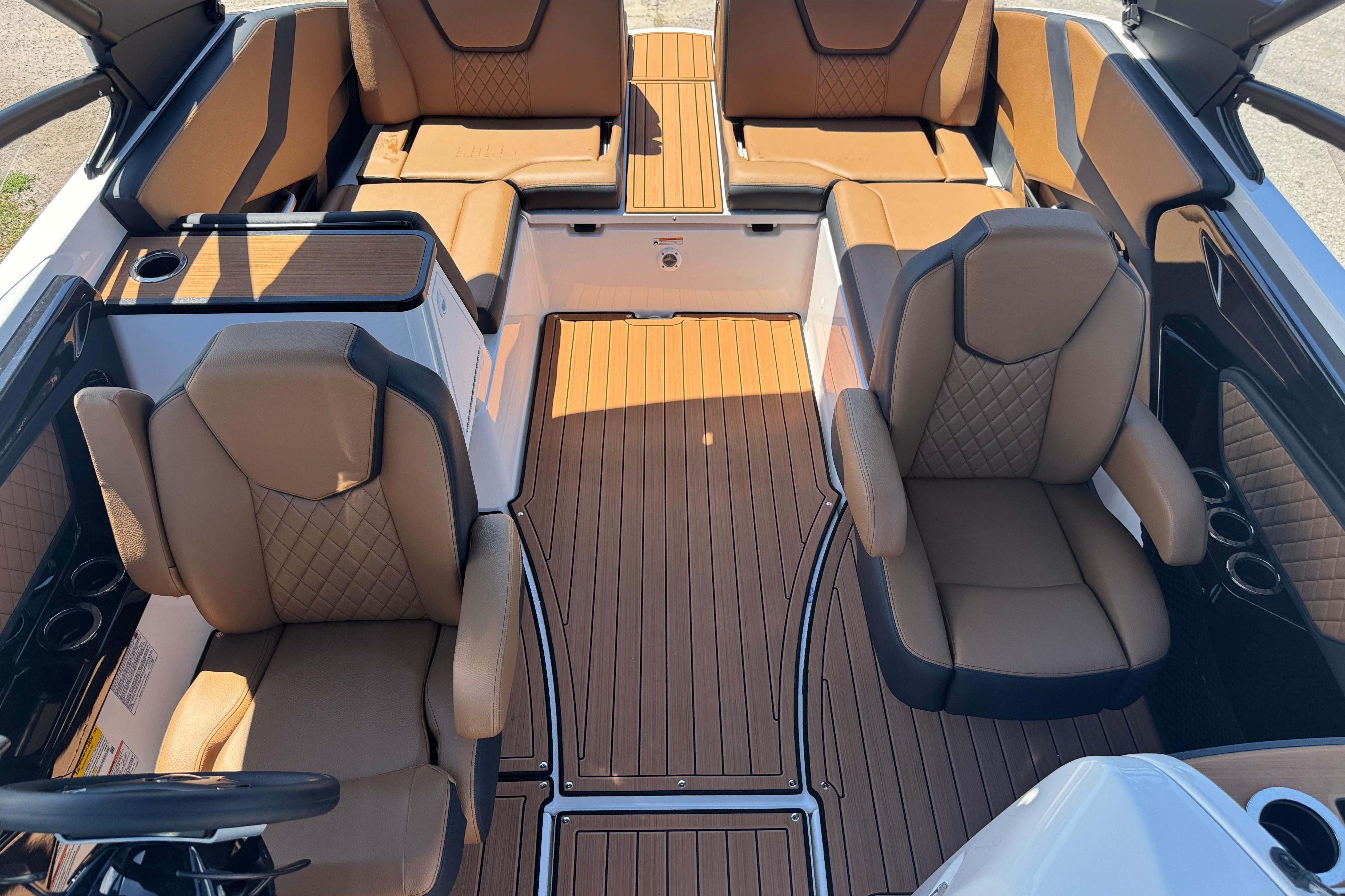 2026 Yamaha Boats 252SD interior with luxurious tan seating and sleek design.