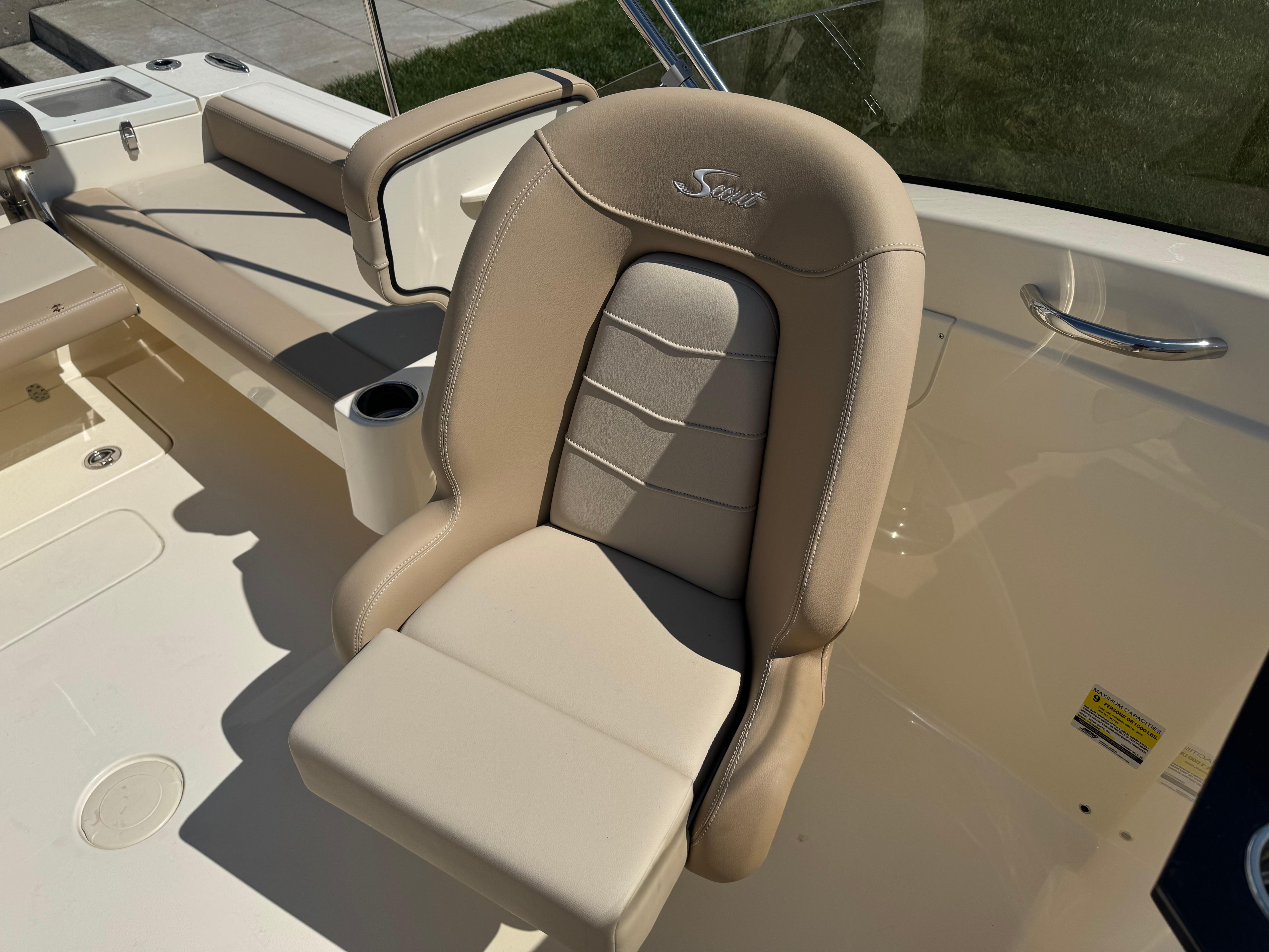 2025 Scout 215 Dorado boat seat with beige upholstery and cup holder.