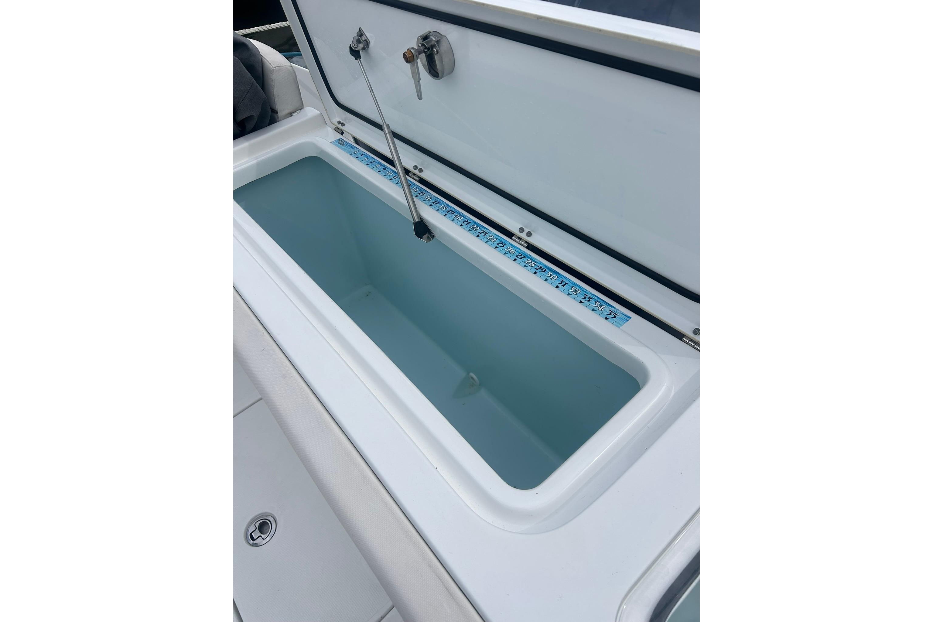 2021 Sea Hunt Gamefish 27 Coffin Box, open lid, spacious interior view.