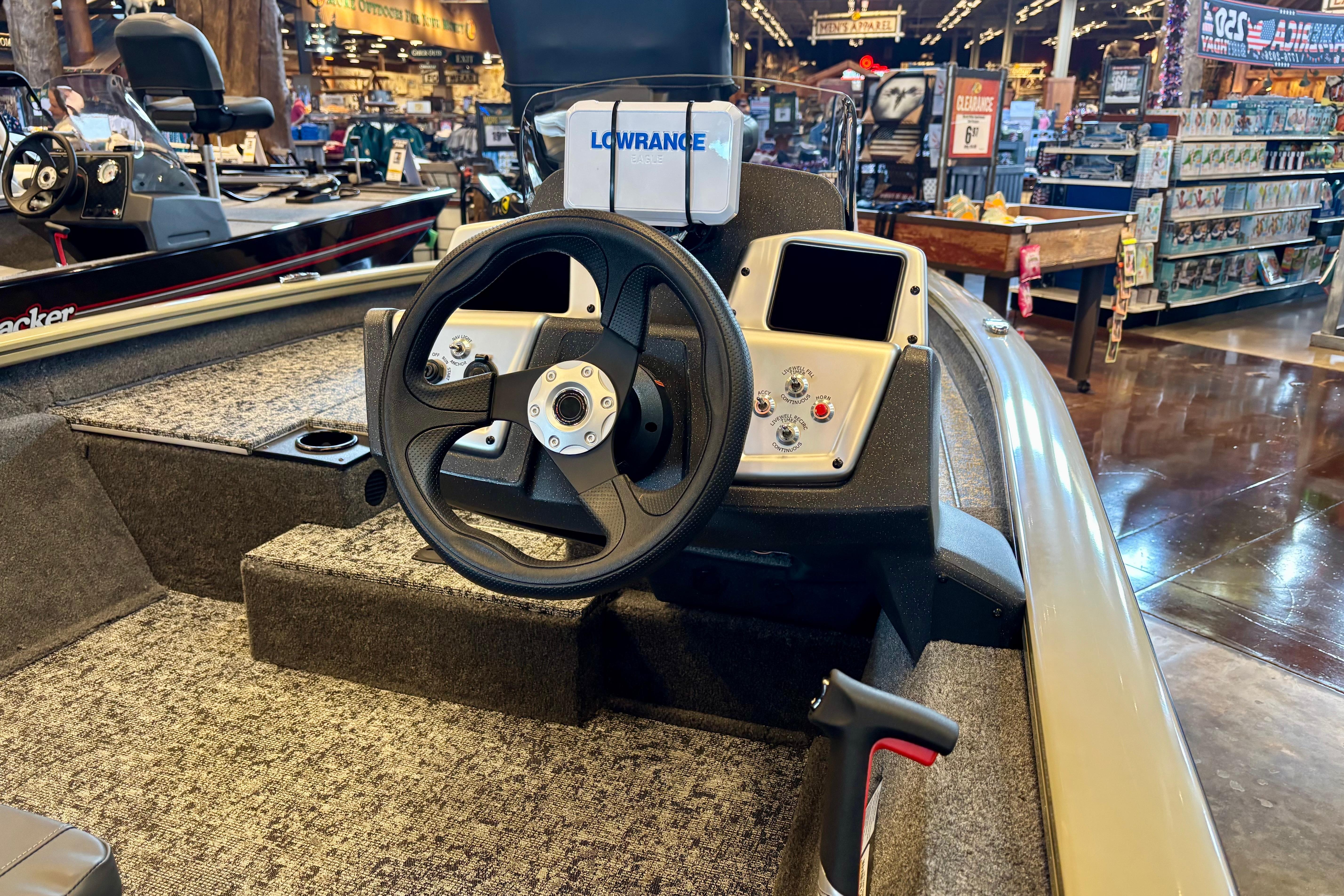 2026 Tracker Pro Team 175 boat interior with steering wheel and control panel.