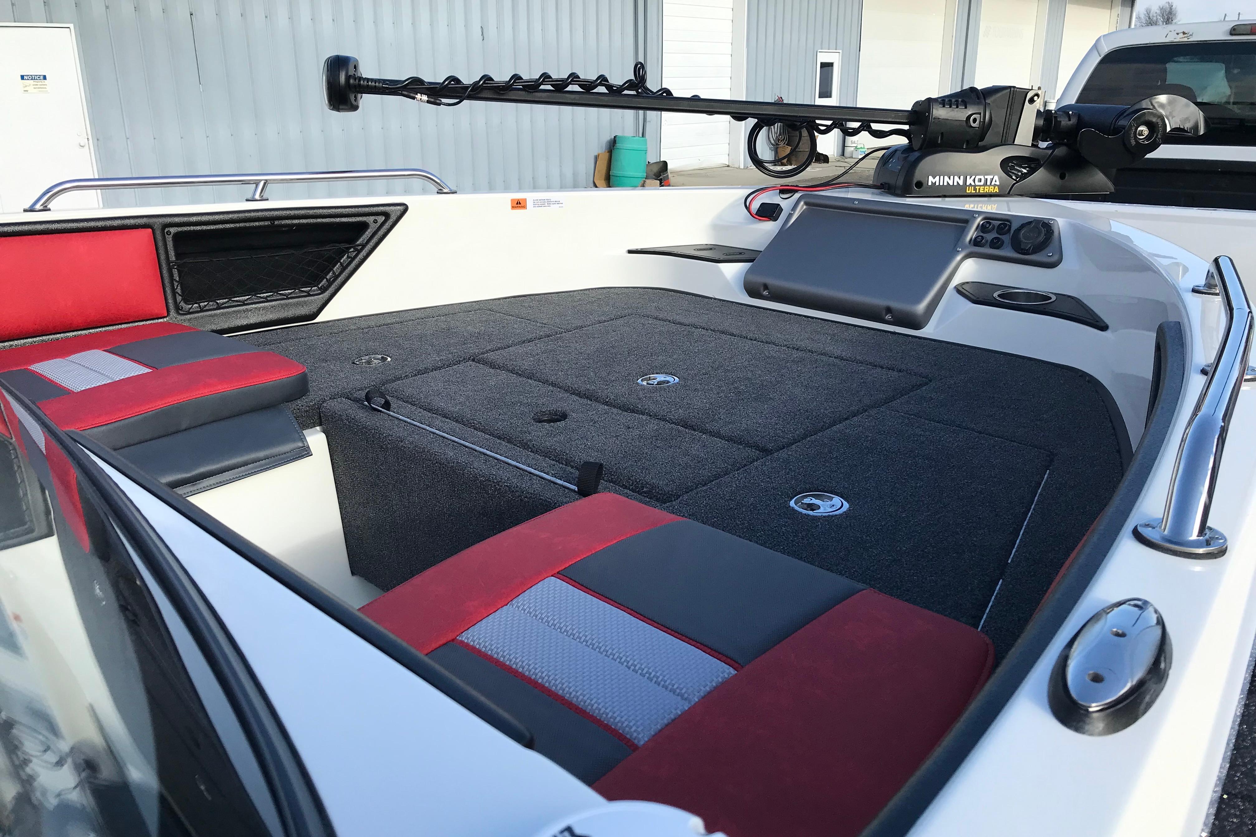 2026 Ranger 1850MS boat interior with red and gray seating, featuring a Minn Kota trolling motor.