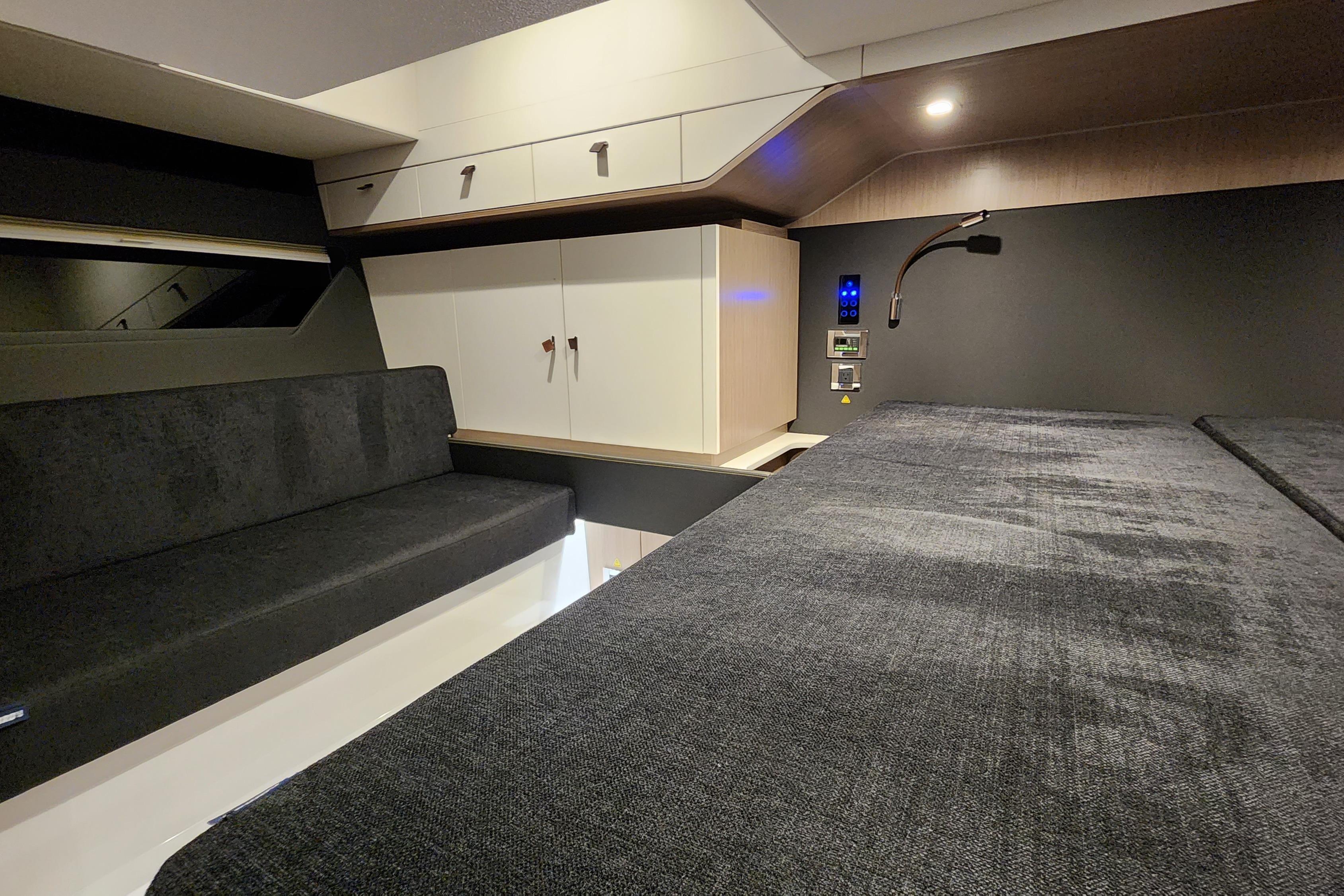 2023 Fjord 41 XL interior cabin with modern design, featuring seating and storage.